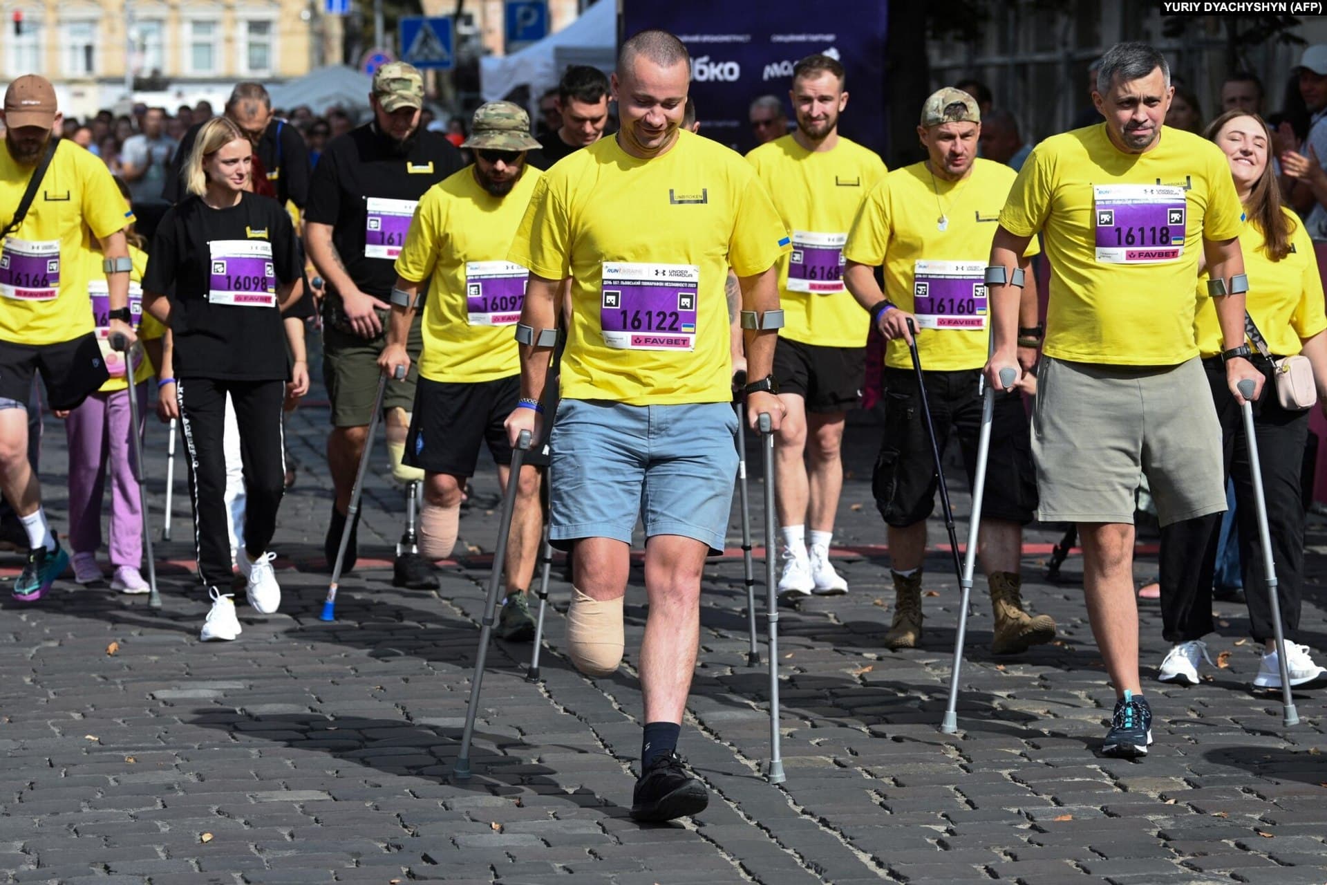 Hundreds of spectators and well-wishers cheered the amputees on as they made their way through the streets of Lviv