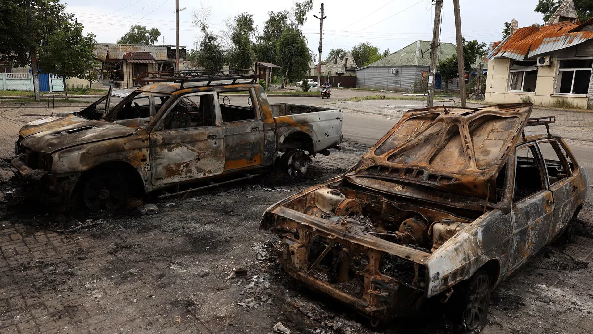 Cars destroyed by an apparent Russian cluster-munitions strike on the Ukrainian town of Lyman