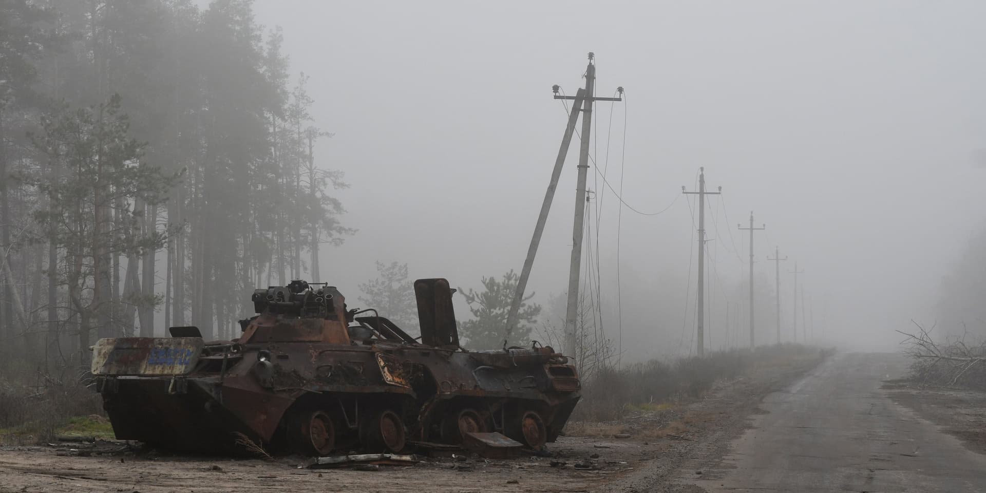 A destroyed Russian military vehicle lies near the recently recaptured village of Yampil