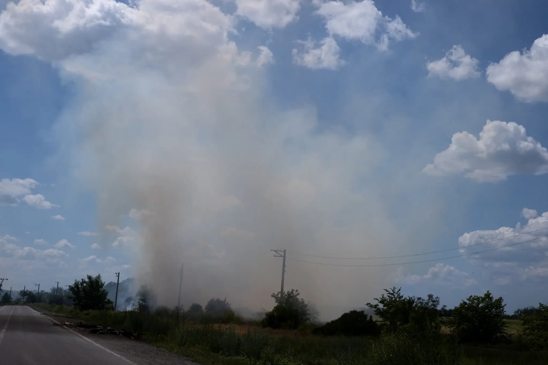 Smoke from a fire caused by an artillery strike targeting a Ukrainian checkpoint in Lysychansk