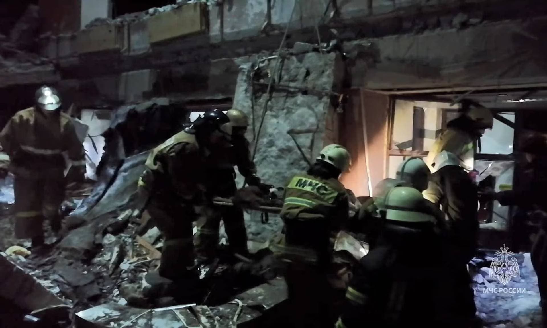 Rescuers working at the site of shelling in the city of Lysychansk