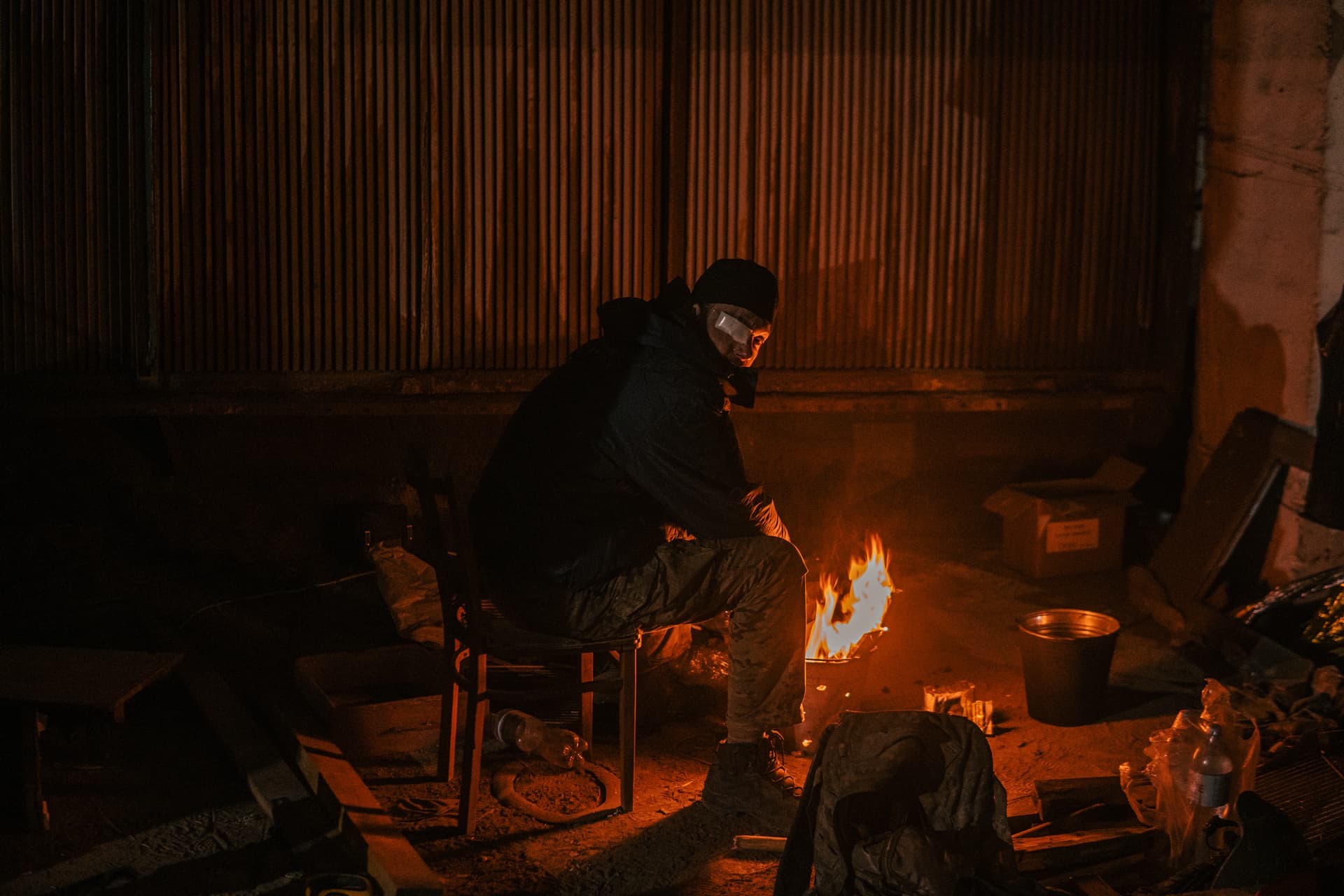 A Ukrainian soldier inside the ruined Azovstal steel plant take a rest in his shelter in Mariupol