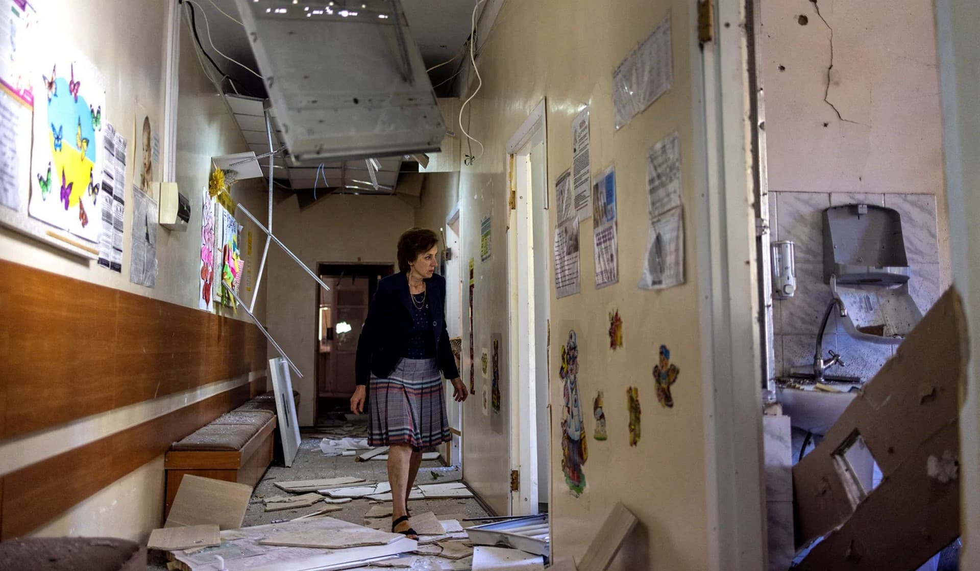 Svitlana Dmtrieva inspects her office and her department destroyed by a military strike in Mykolaiv