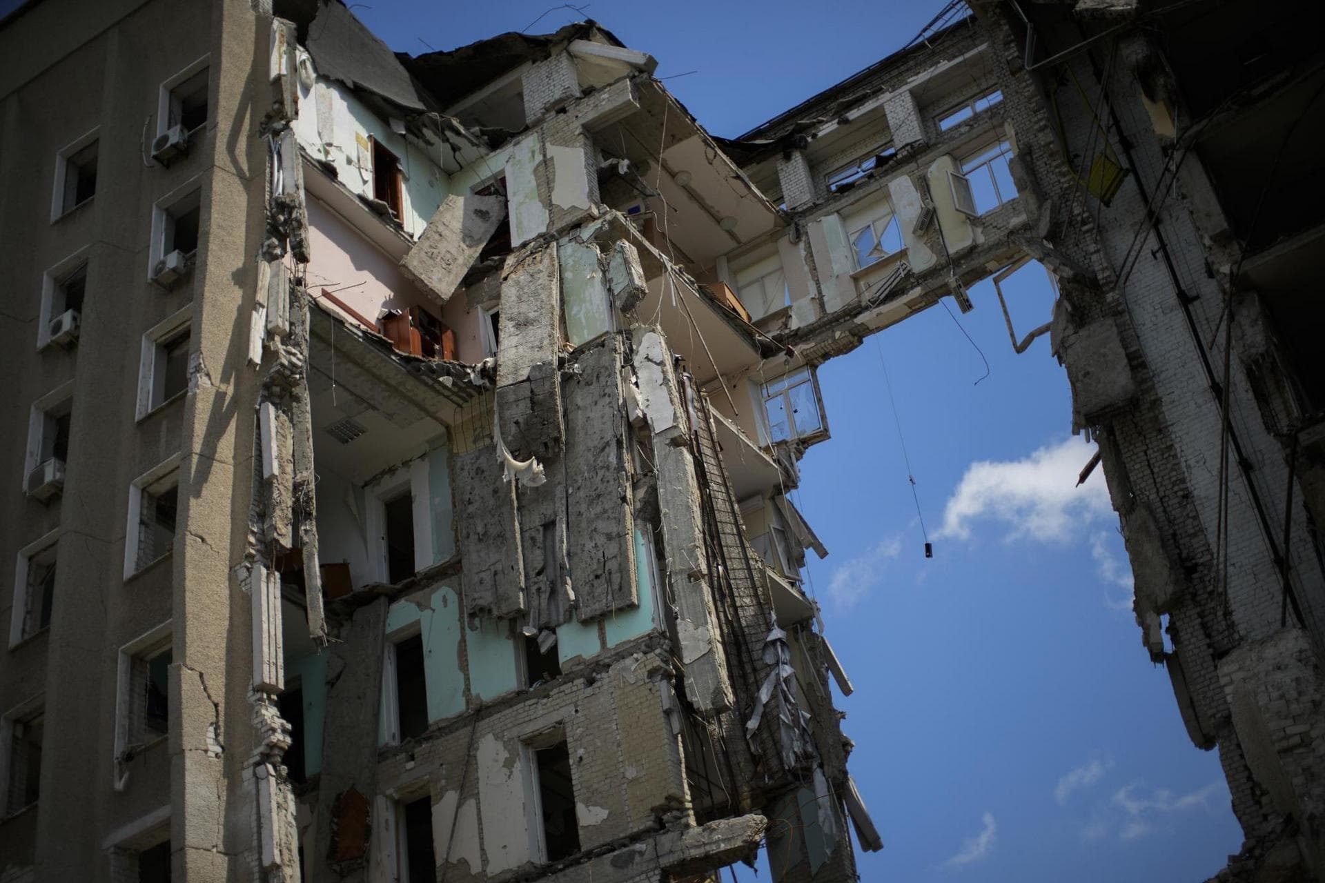 Pieces of debris hang at the regional government headquarters of Mykolaiv