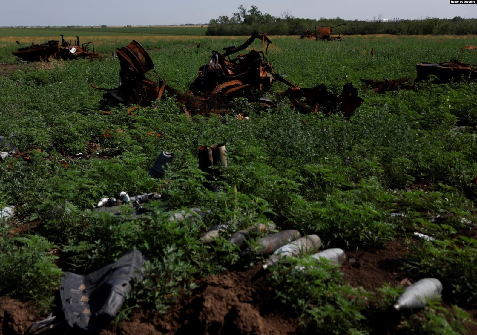 Destroyed Russian tanks and vehicles are seen in a field in the Mykolayiv region