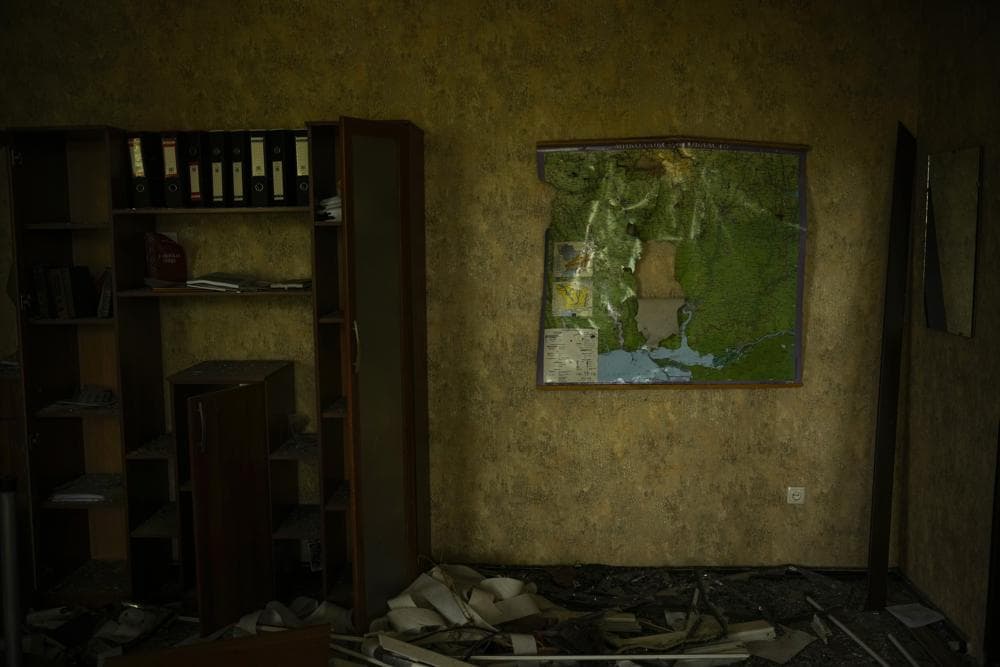 A torn map of the region of Mykolaiv hangs on a wall in an office of the regional government headquarters of Mykolaiv