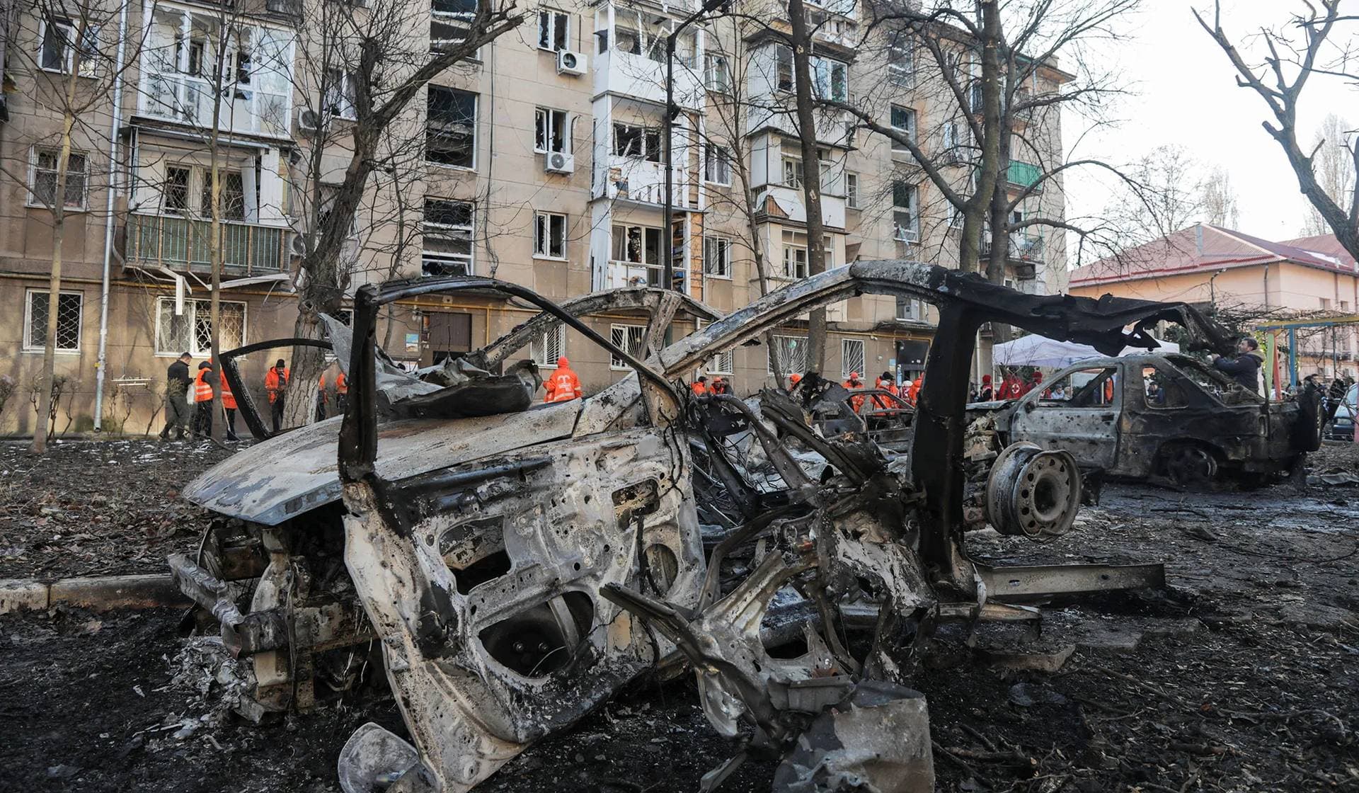 Destroyed cars and an apartment building damaged during a Russian drone strike in Odesa