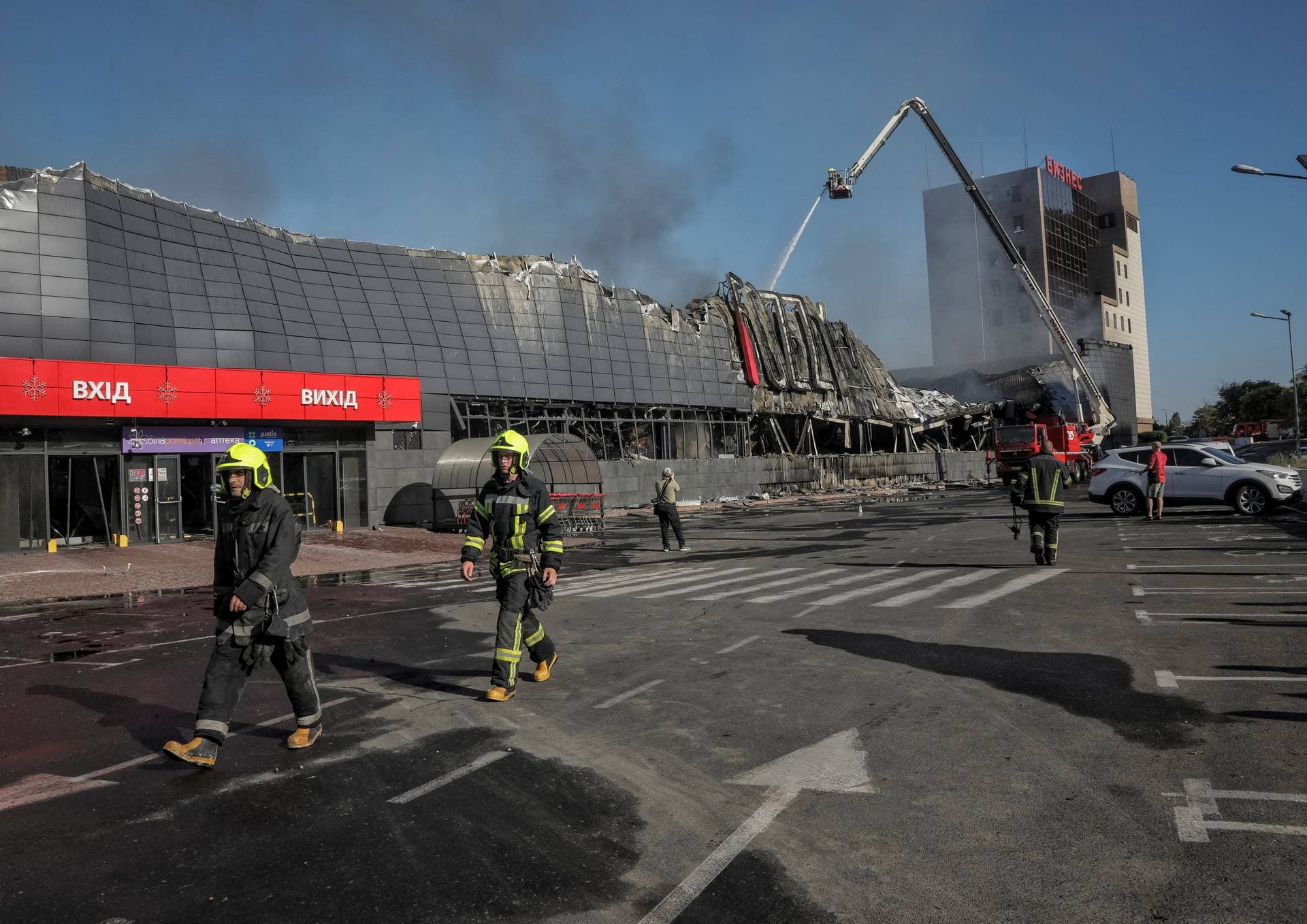 Rescuers work at a site of a shopping mall destroyed during a Russian military strike in Odesa