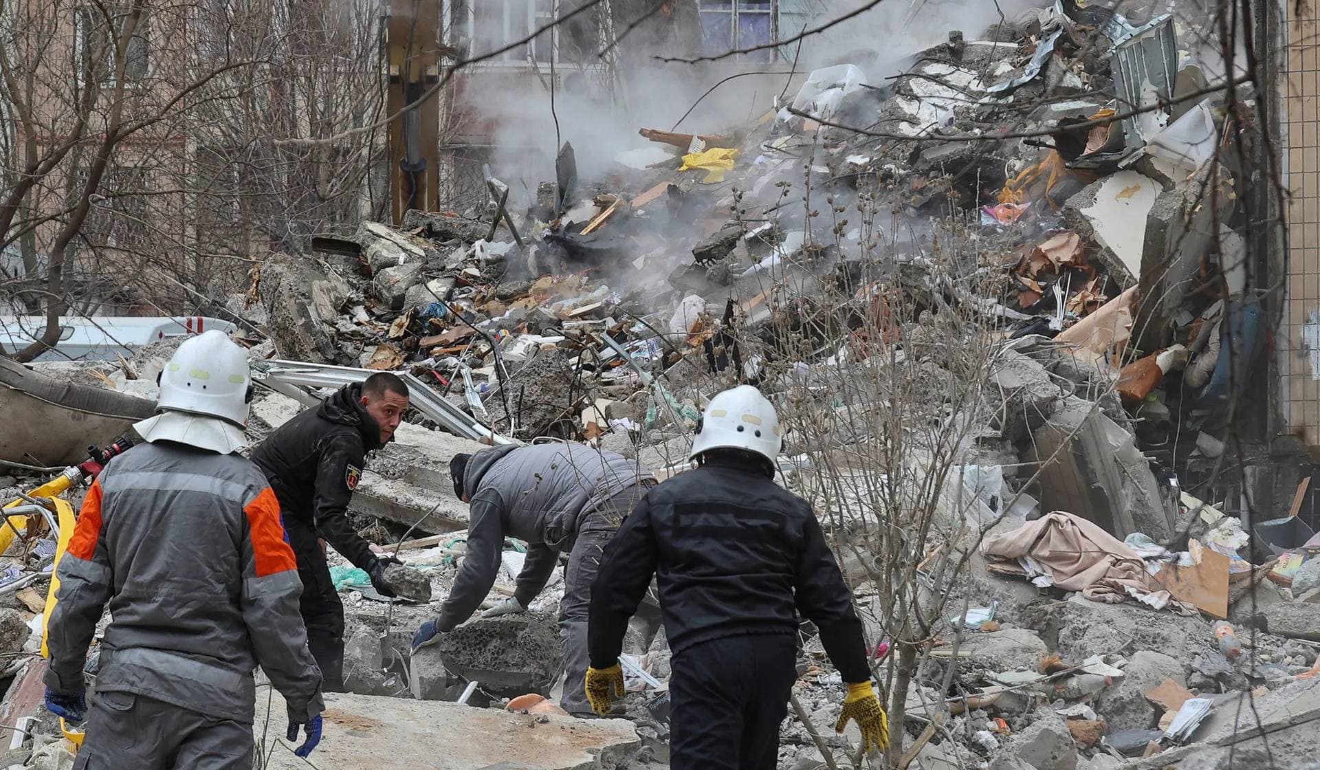 Rescuers work at the site of an apartment building heavily damaged by a Russian drone strike in Odesa