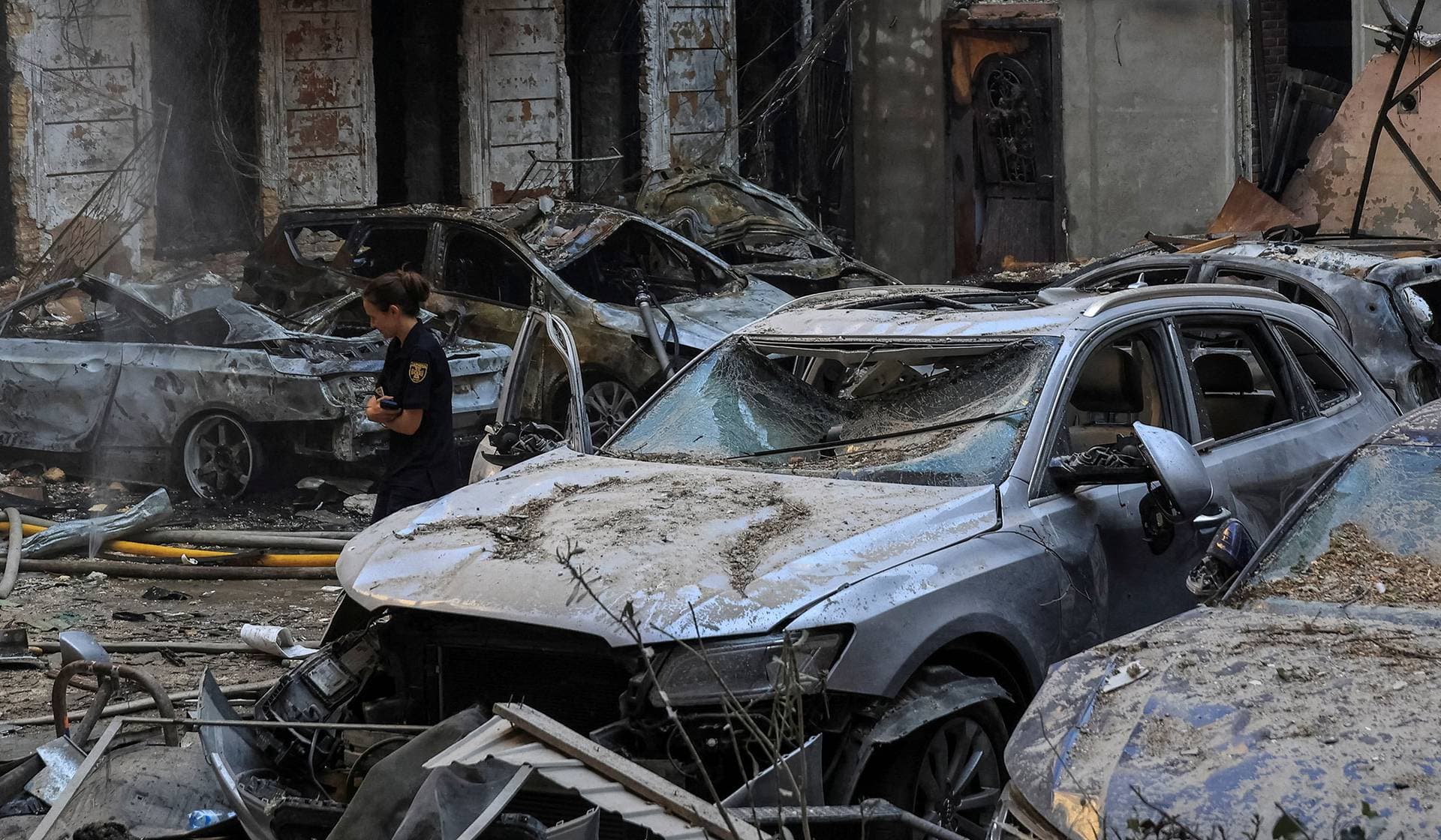 A police officer works at a site of apartment buildings damaged during a Russian missile and drone strike in Odesa