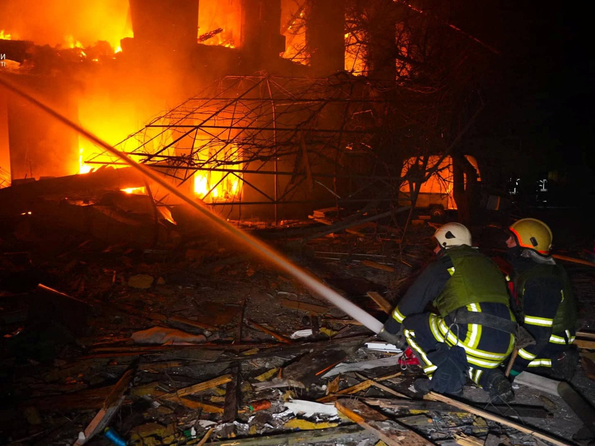 Firefighters work at a site of Russian drone and missile strikes in Odesa
