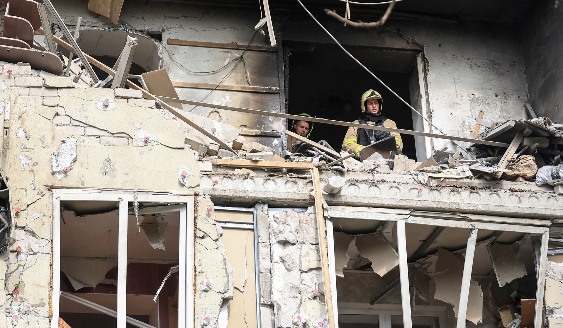 Rescuers work at the site of an apartment building damaged during a Russian drone strike in Odesa