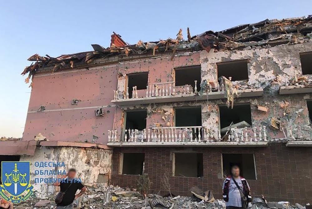 a damaged residential building is seen in Odesa