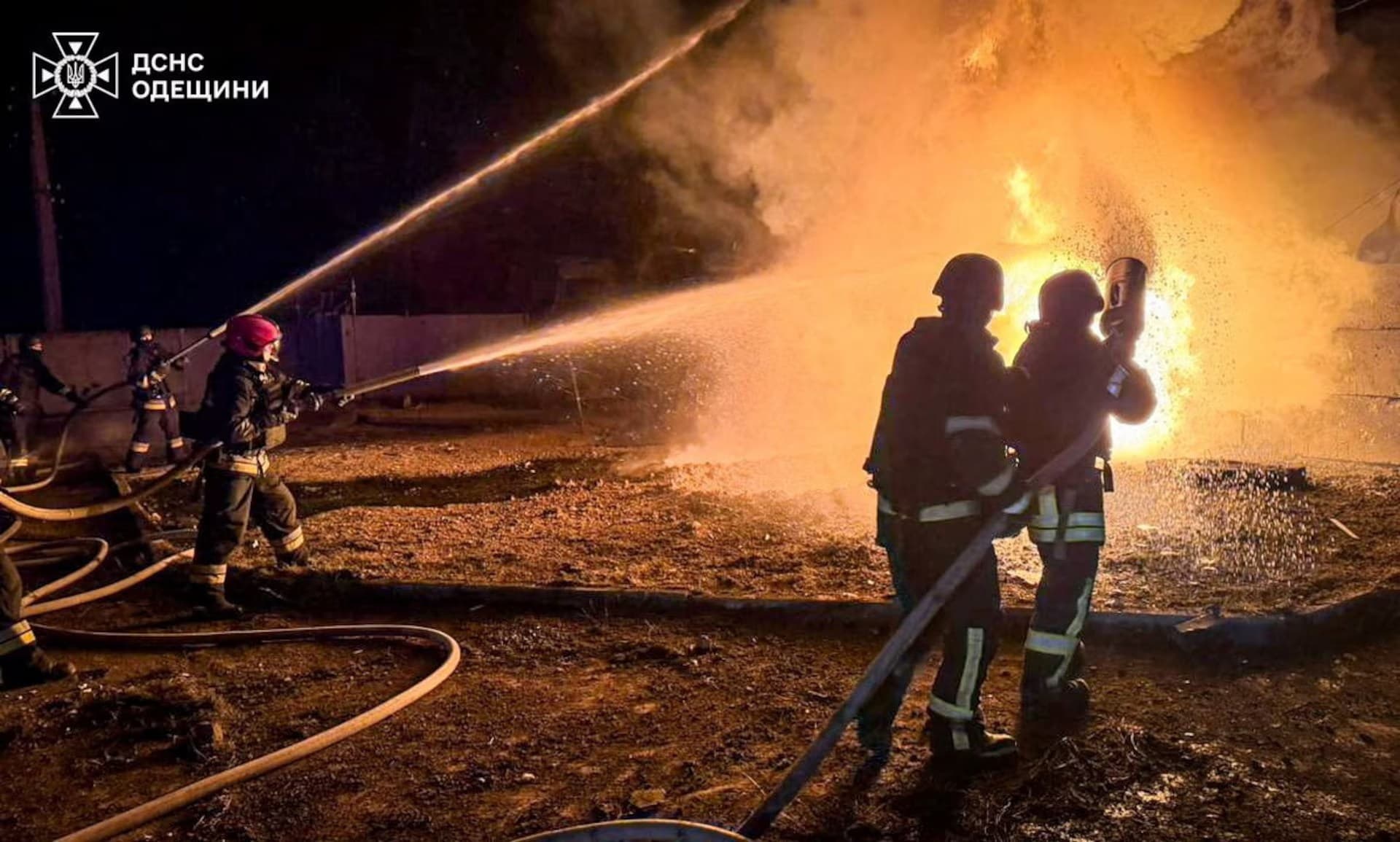 Firefighters work at the site of the Russian drone strike in Odesa Region
