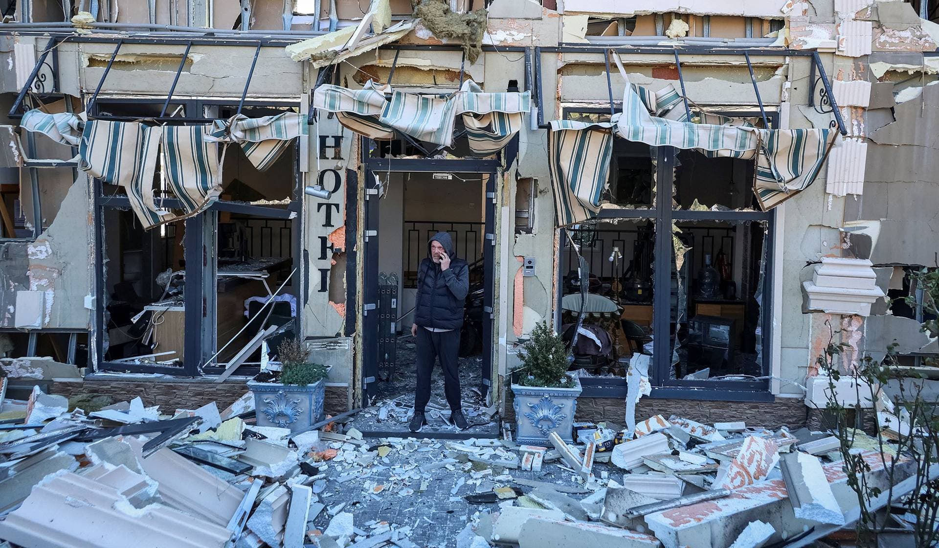 A man stands in a hotel hit by a Russian drone strike in Odesa