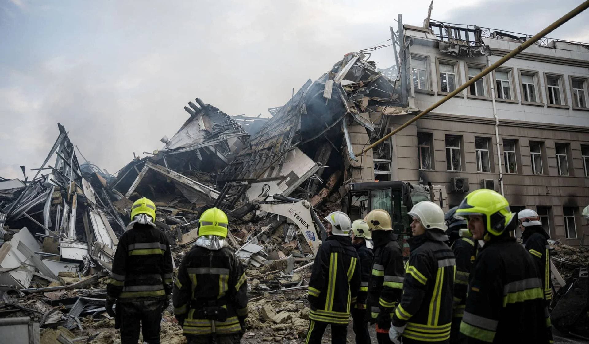 Rescuers work at a site of an administrative building heavily damaged by a Russian missile strike in Odesa