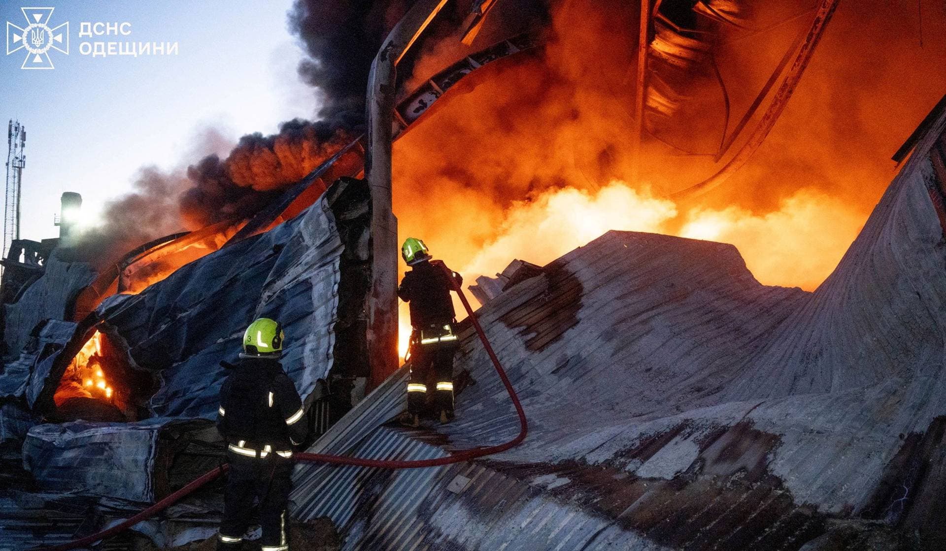 Firefighters work at the site of a warehouse of home appliances which was hit during an overnight Russian drone strike in Odesa
