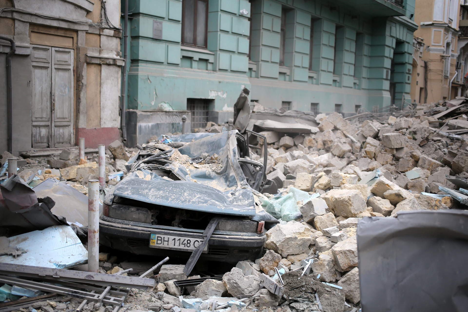 A destroyed car lies amid rubble in the historical center of city on July 23, 2023 in Odesa