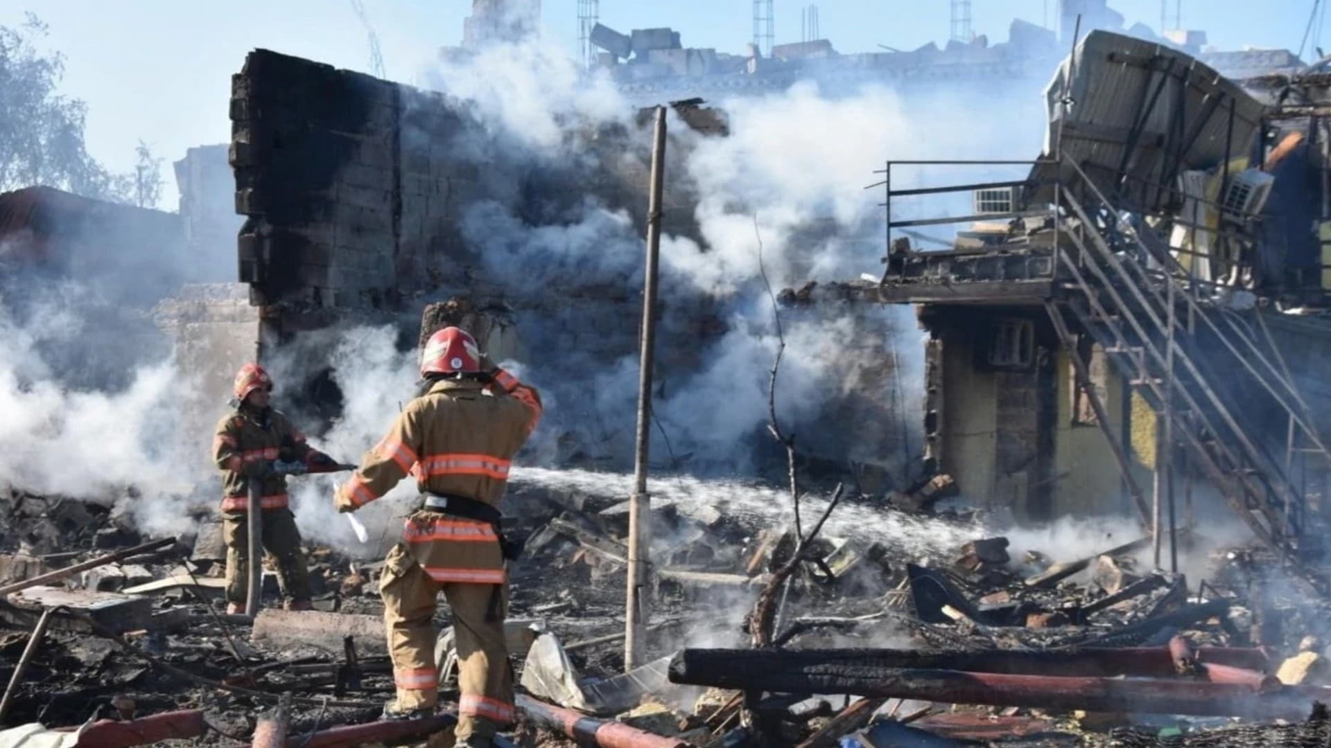 Firefighters work at the site of a residential area damaged by a Russia missile strike in Odesa