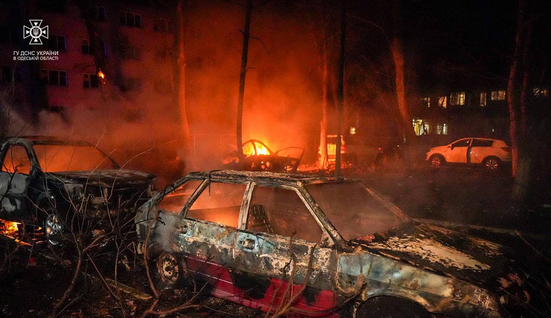 Destroyed cars next to a residential building damaged during a Russian drone strike in Odesa
