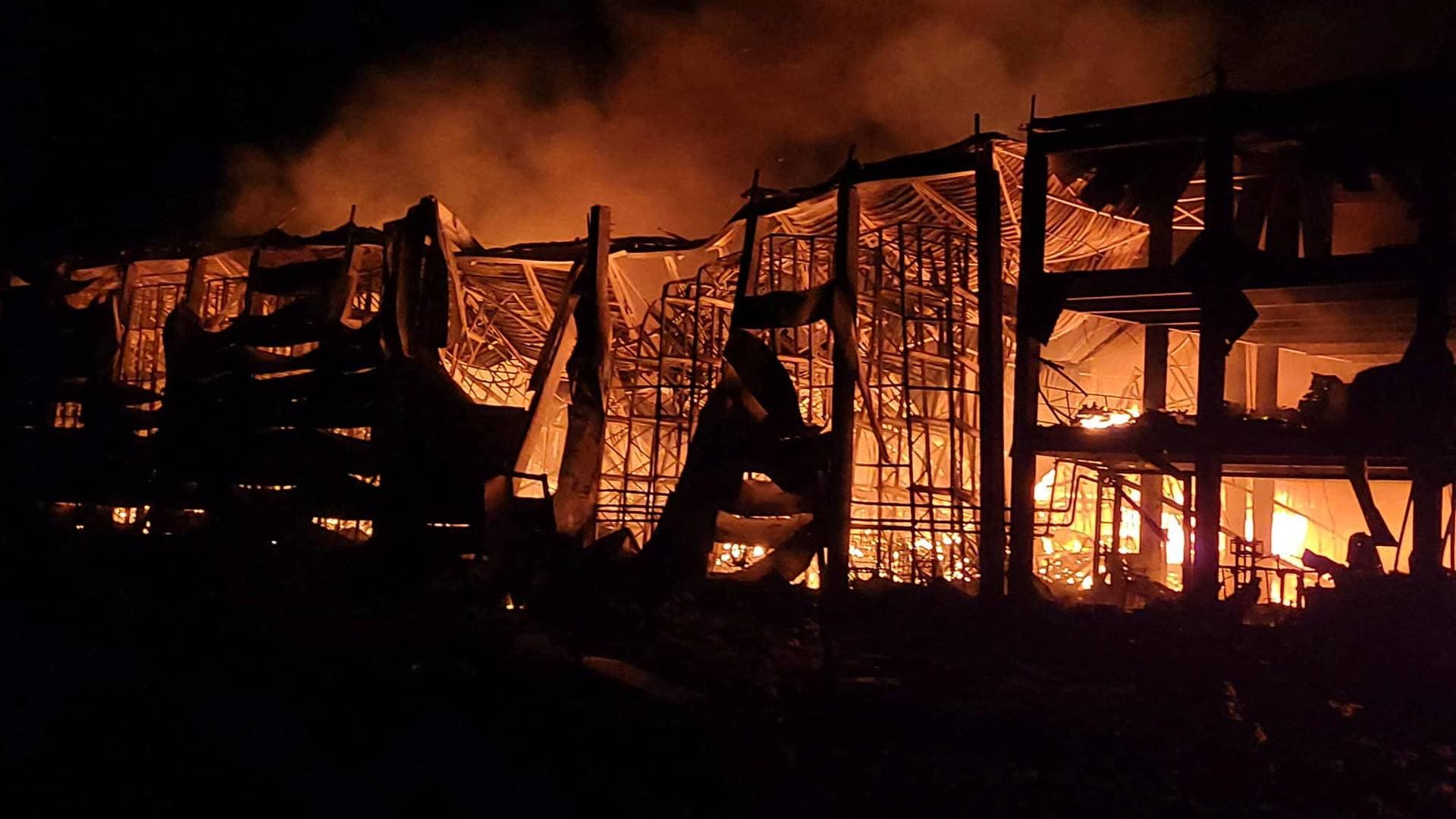 burning storage facilities heavily damaged by a Russian missile strike in Odesa region