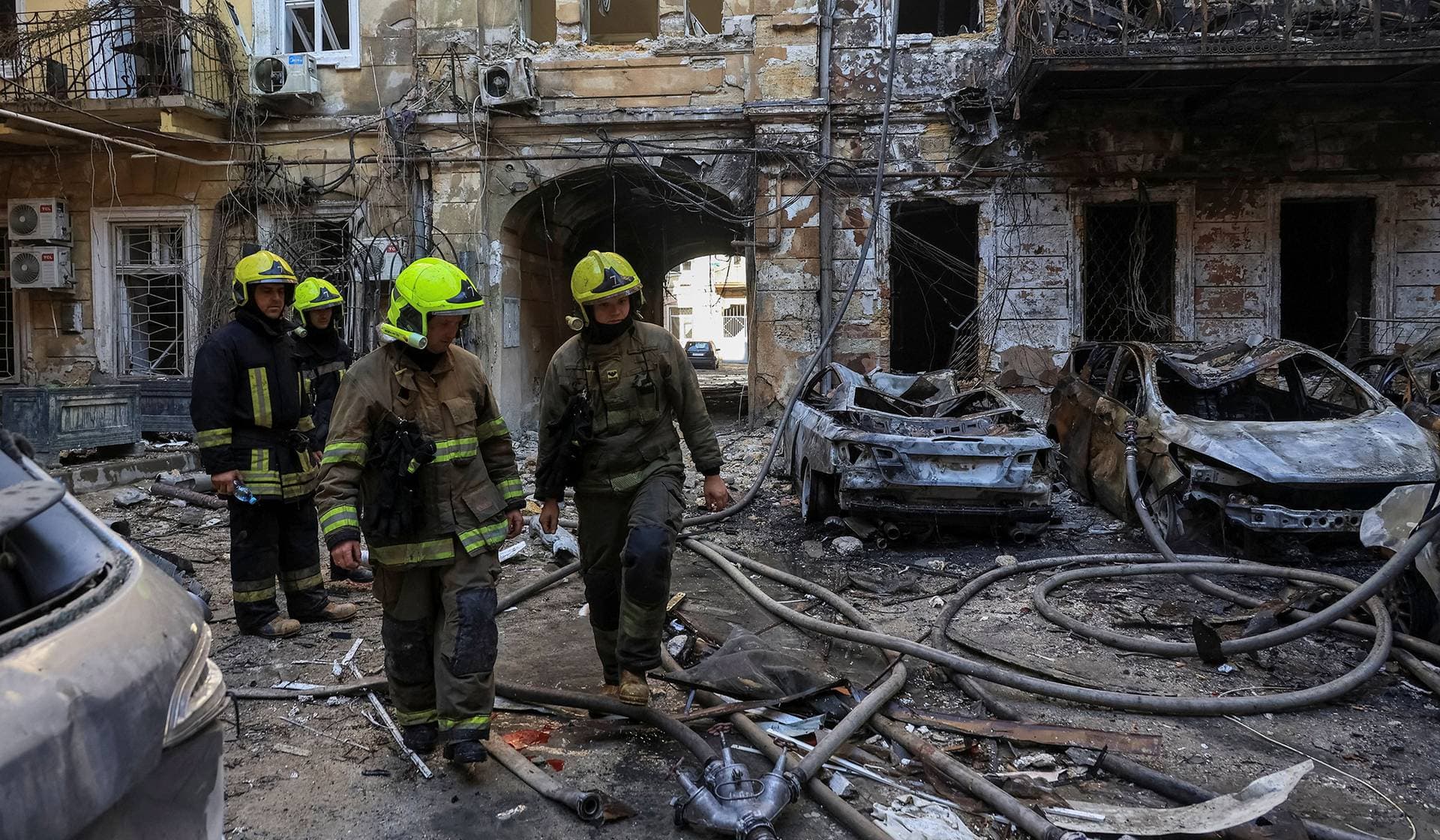 Rescuers work at a site of apartment buildings damaged during a Russian missile and drone strike in Odesa