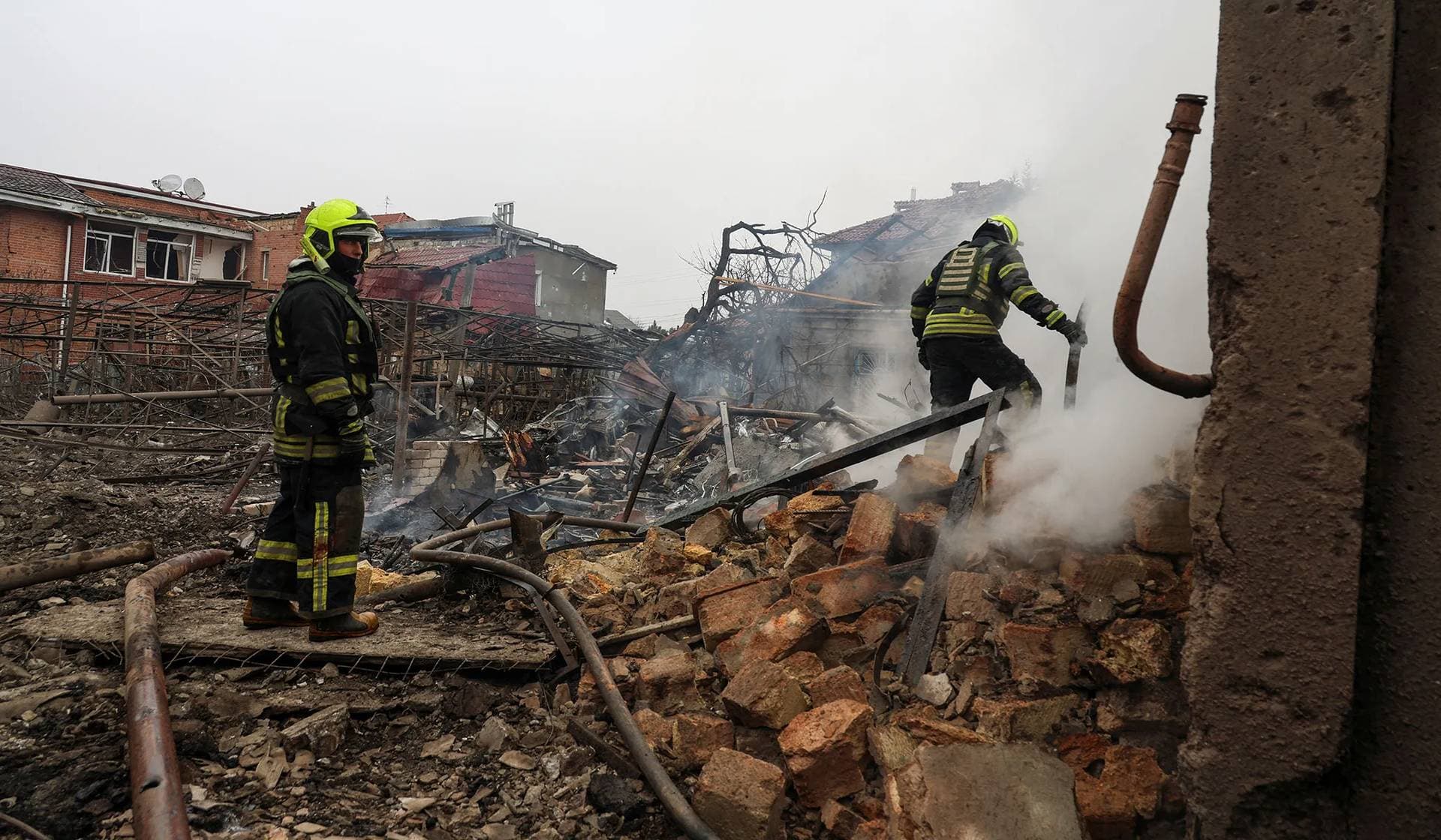 Rescuers work at the site of a residential area hit by a Russian missile strike in Odesa
