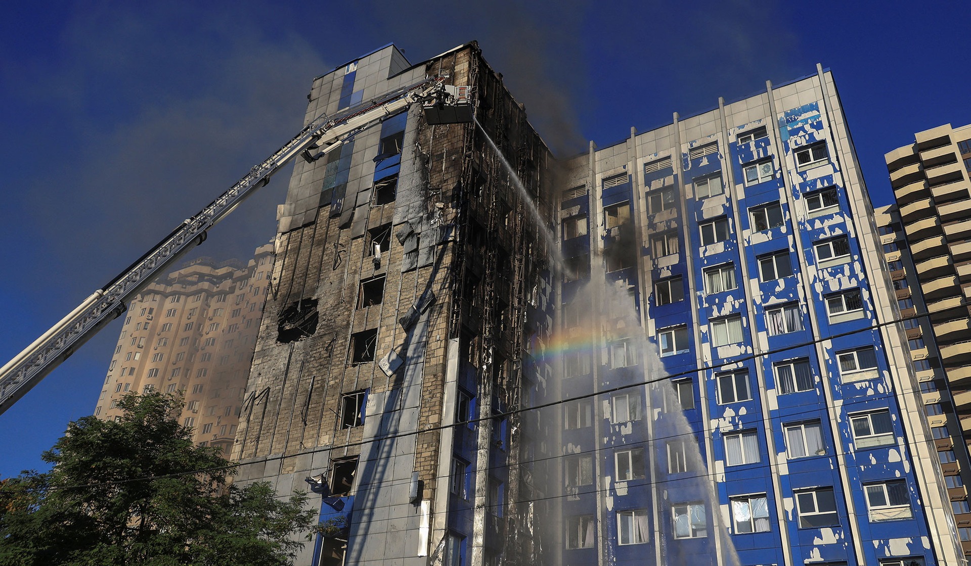 Firefighters work at the site of an office building hit by a Russian drone strike in Odesa