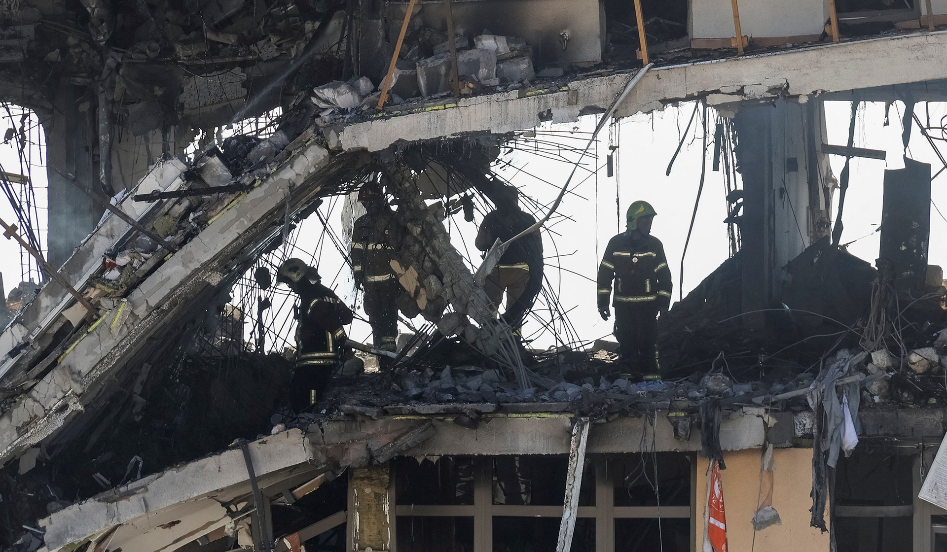 Rescuers work at the site of an apartment building damaged during a Russian drone strike in Odesa