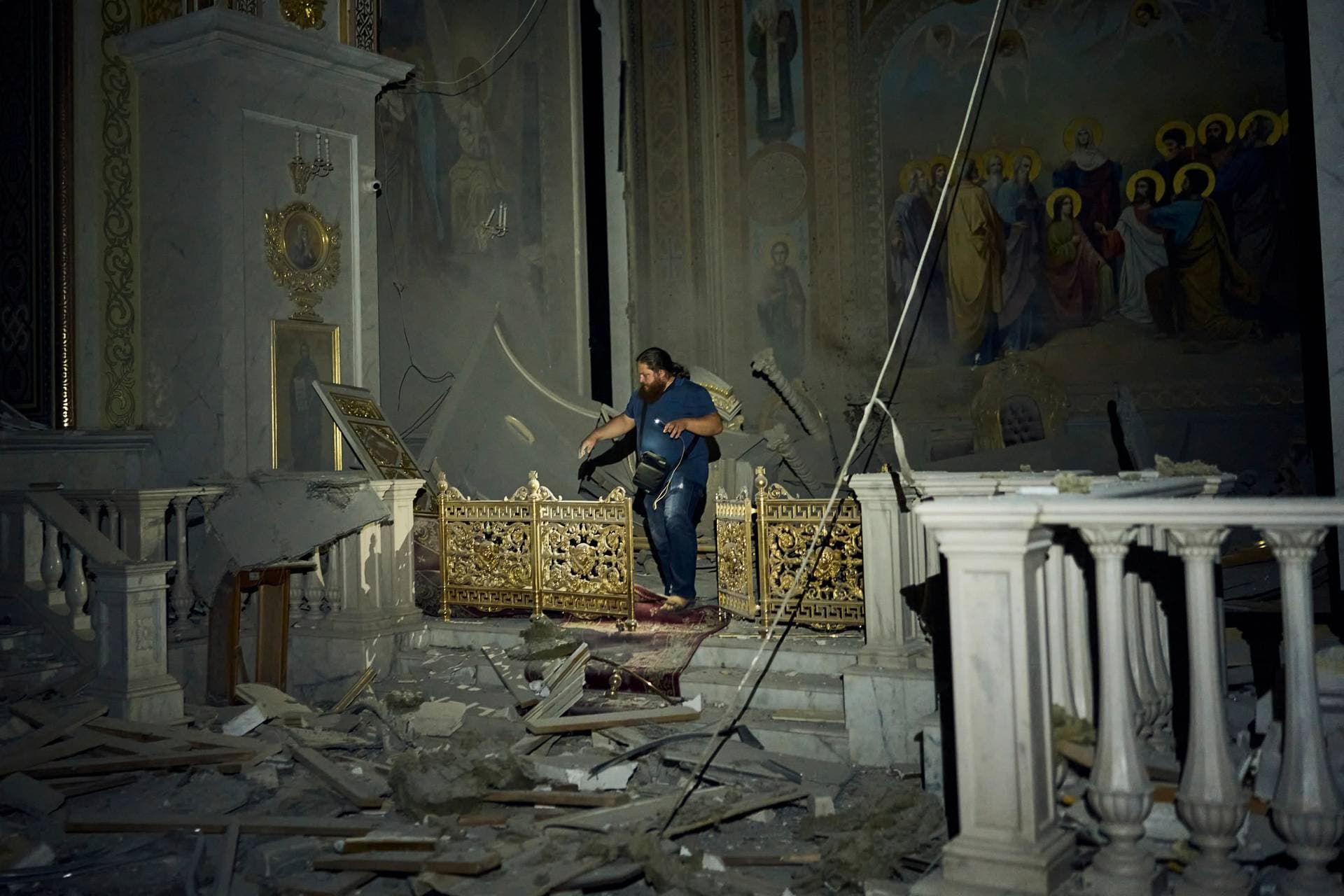A man walks inside the Odesa Transfiguration Cathedral, damaged in a Russian missile attack in Odesa, Ukraine, on Sunday. 