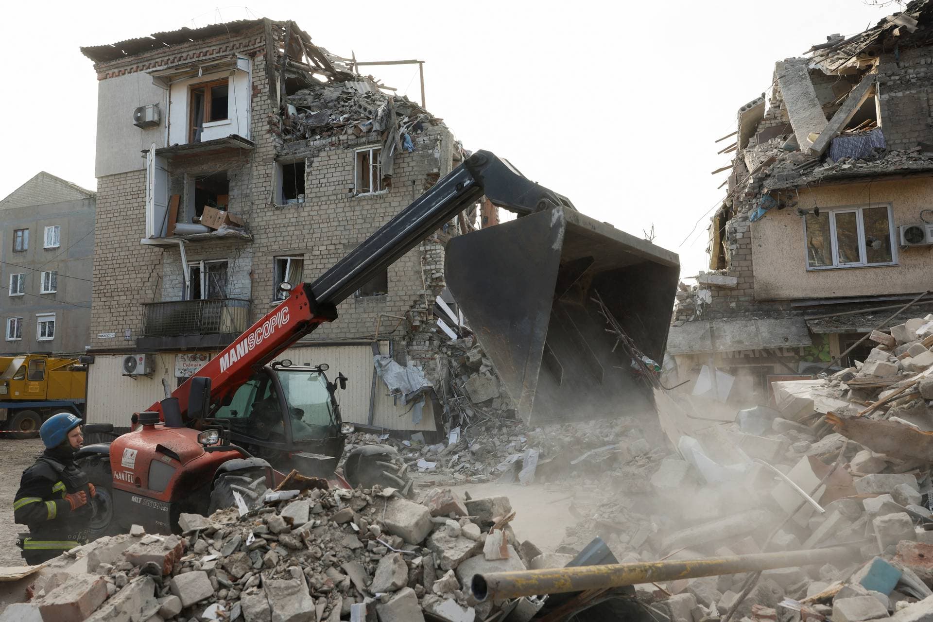 A rescuer works at the site of residential houses heavily damaged by a Russian missile strike in the town of Selydove