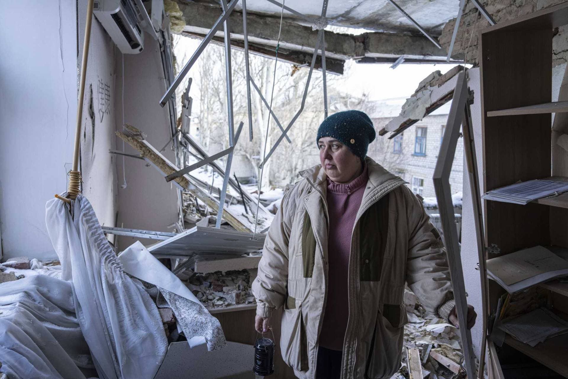 lab medic stands inside a hospital which was damaged by Russian shelling in Krasnohorivka