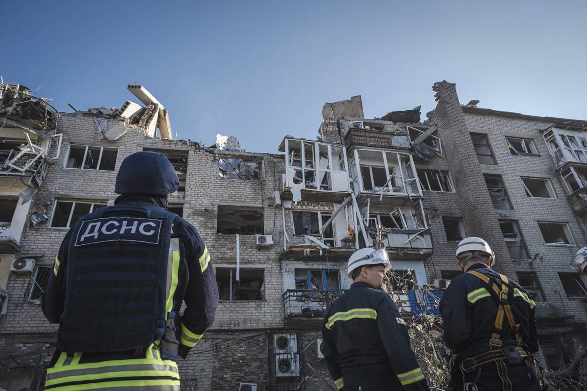 The Ukrainian Emergency Service rescuers work on the scene of a building damaged after Russian missile strikes in Pokrovsk