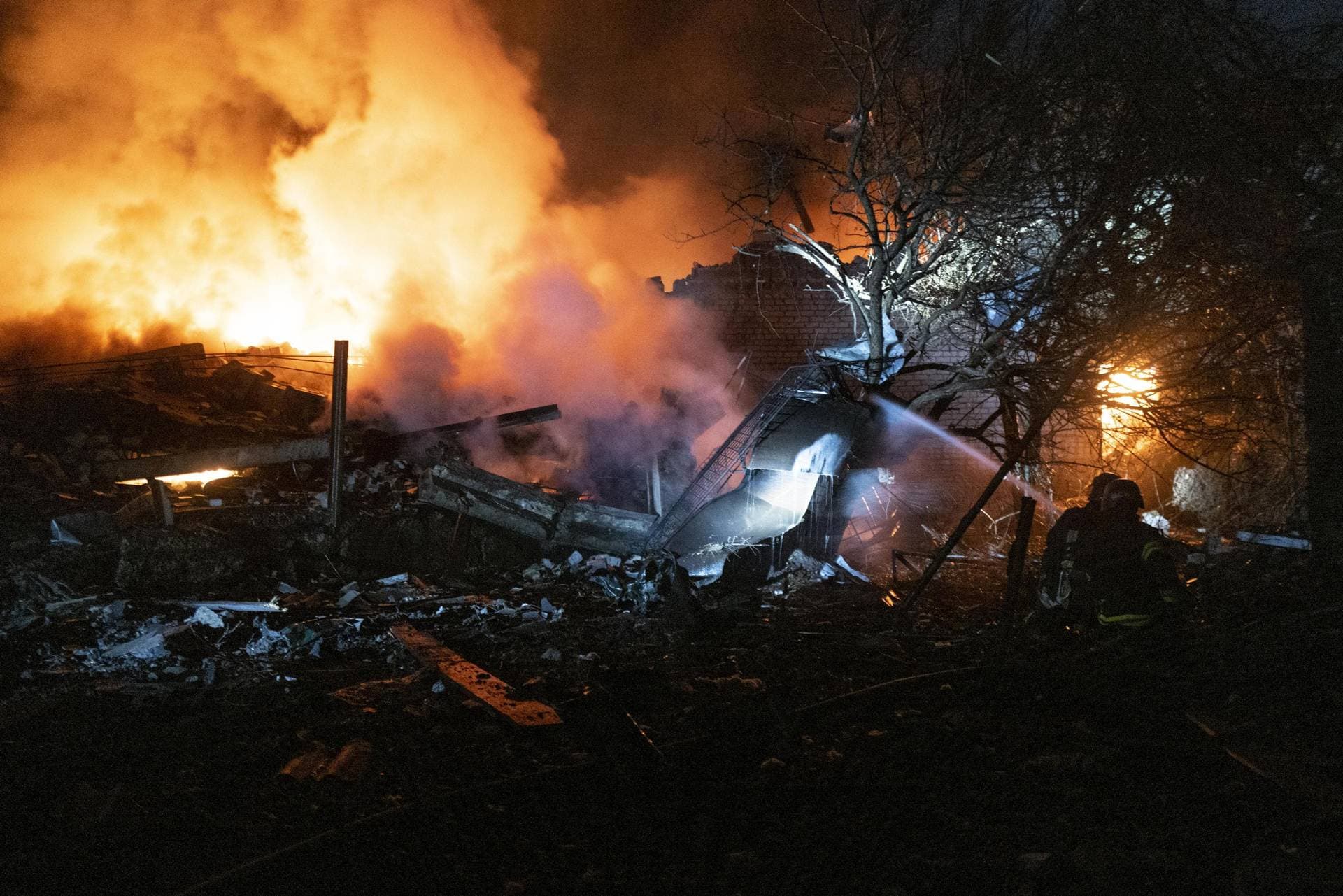 Firefighters try to extinguish a fire after Russian shelling at night in Pokrovsk