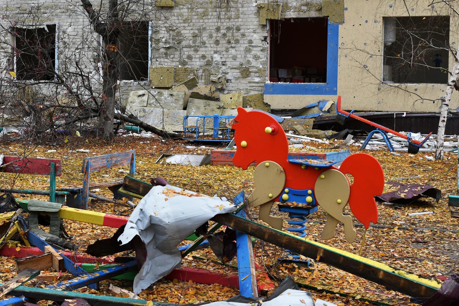 A destroyed school yard after Russian shelling is seen in Pokrovsk