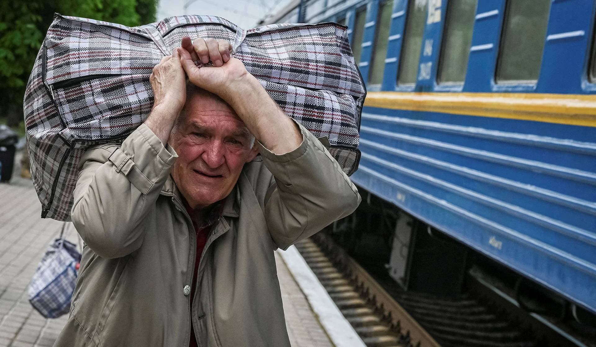 A man boards a train to Lviv during an evacuation effort from war-affected areas of eastern Ukraine in Pokrovsk
