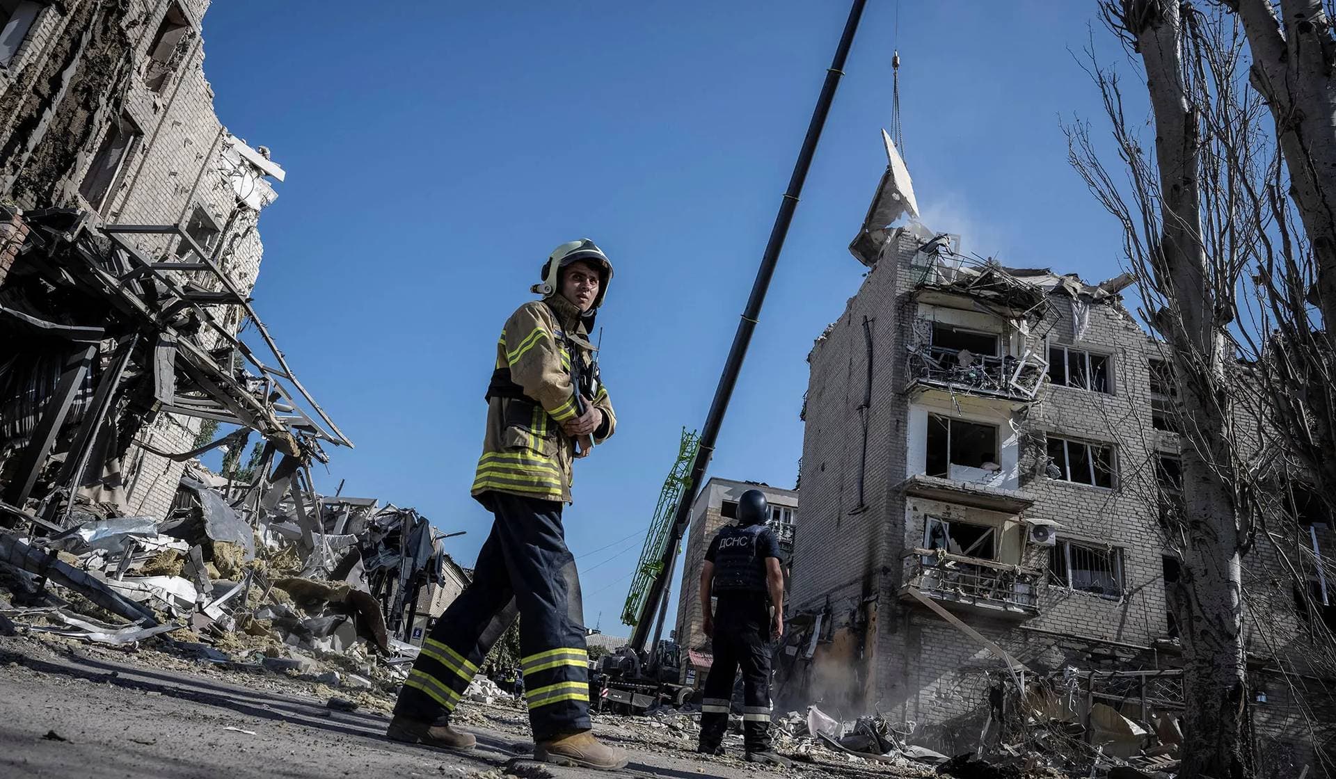 Rescuers work at the site of a building destroyed during a Russian missile strike in Pokrovsk