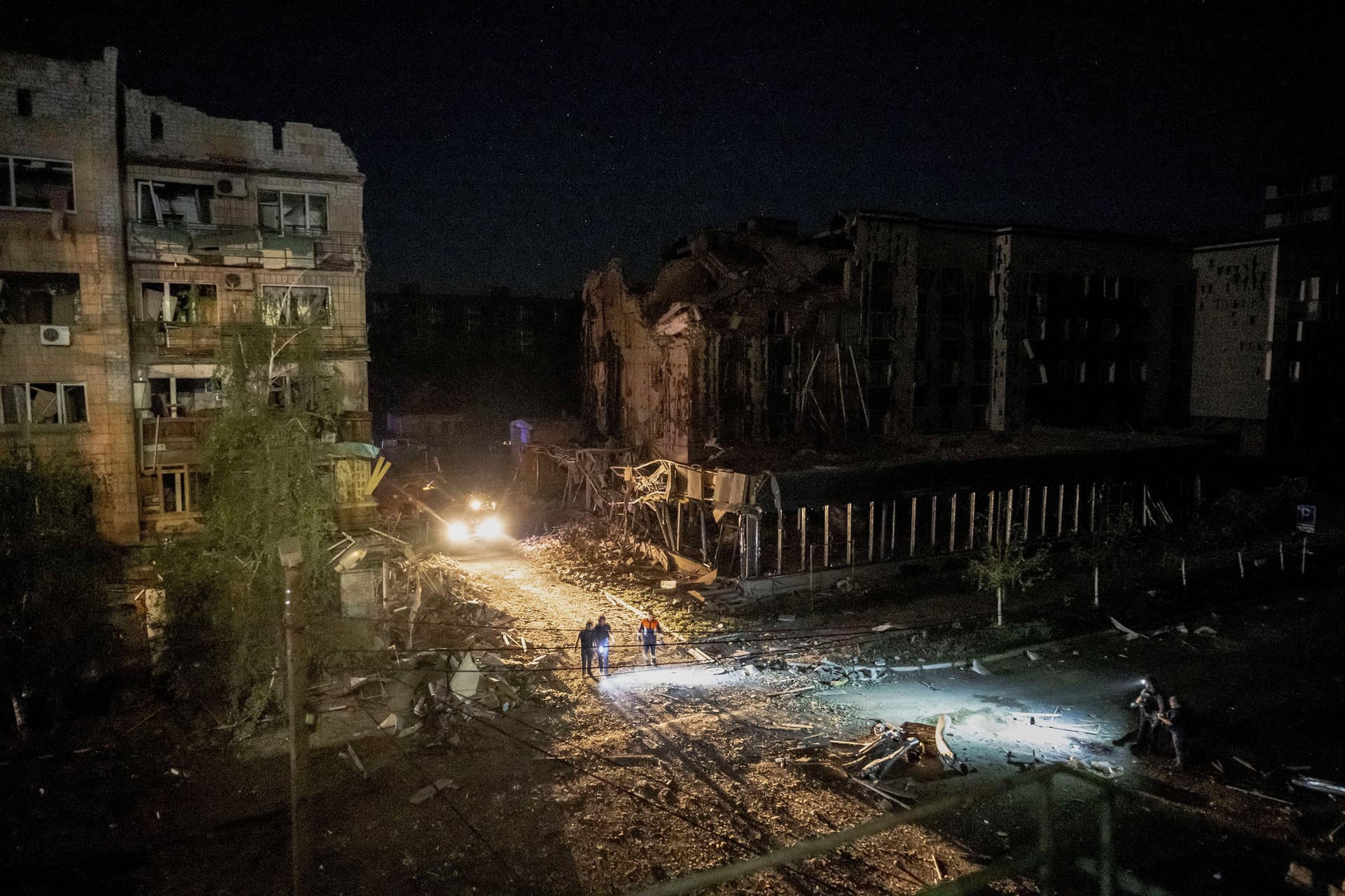 Rescuers work at a site of a building destroyed during a Russian missile strike in Pokrovsk