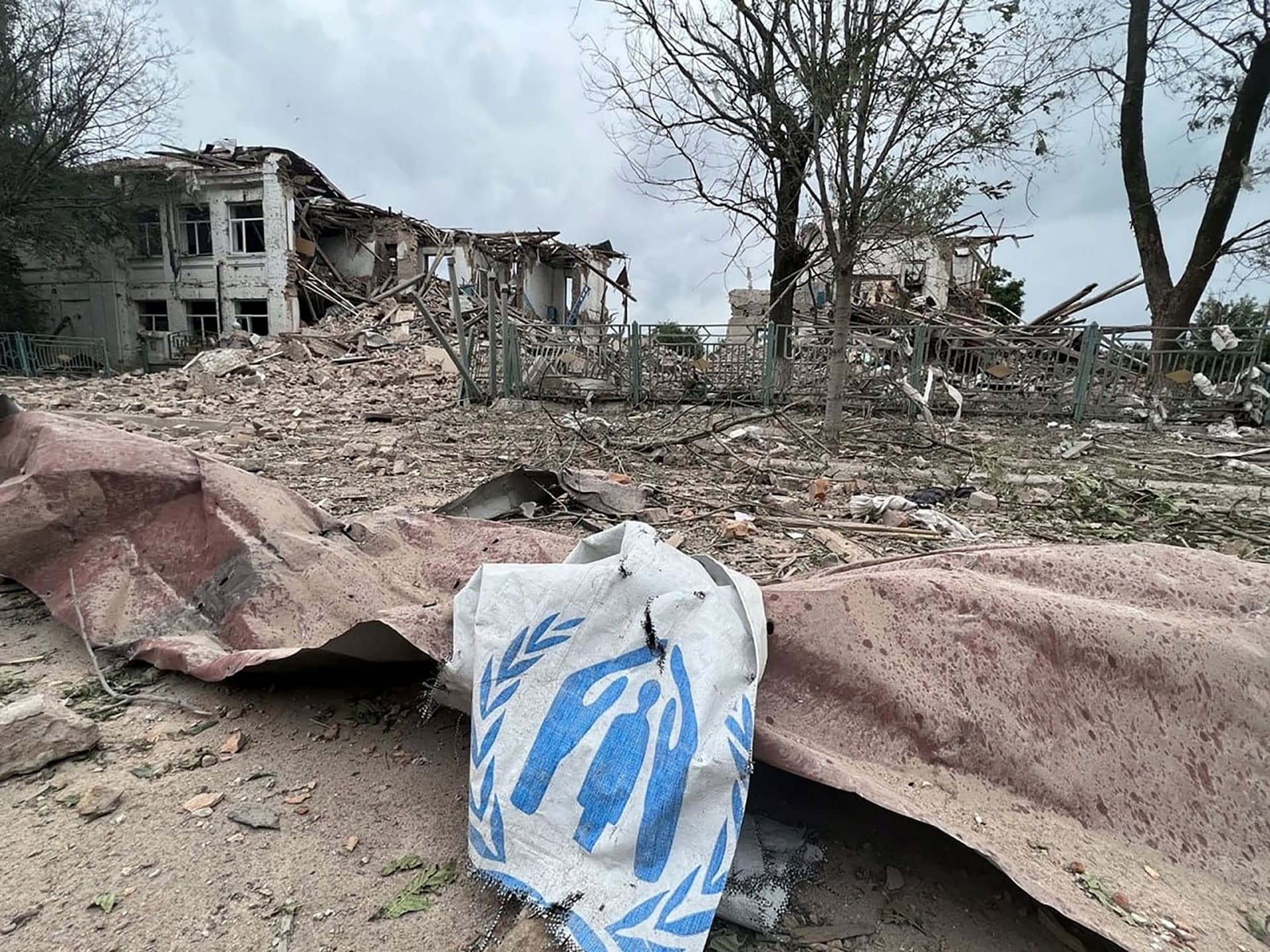 debris from destroyed buildings is strewn along the ground after a Russian airstrike in Orikhiv