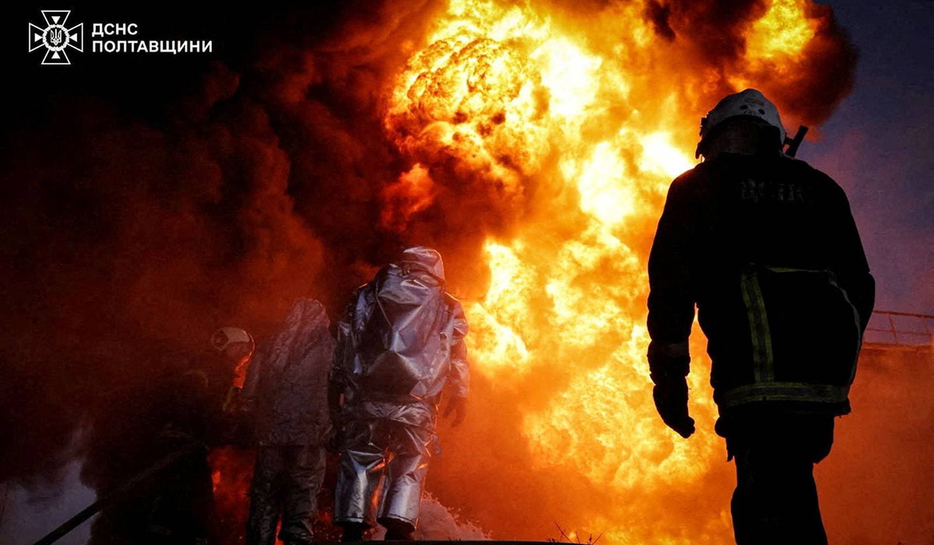 Firefighters work at a site of a Russian missile and drone strike in Poltava Region