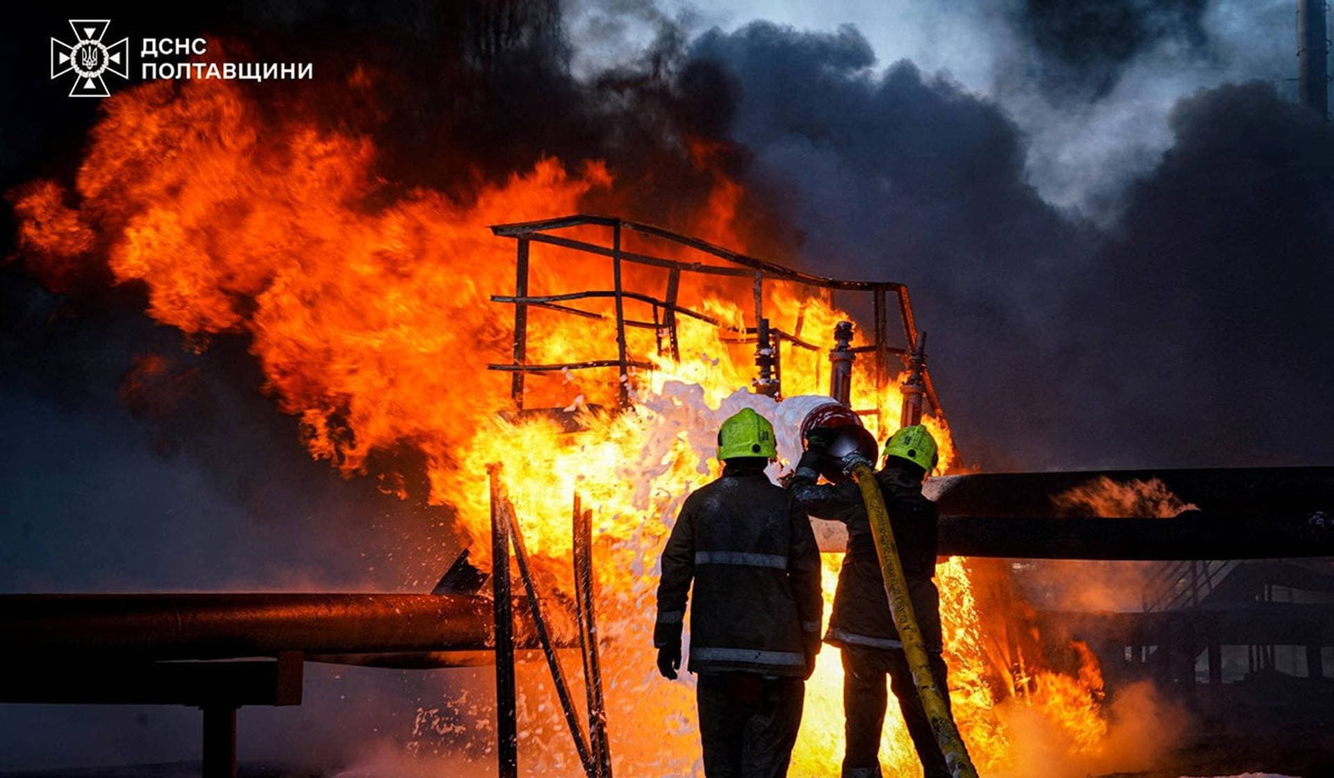 A firefighter works at the site of a building damaged during overnight Russian drone and missile strikes in Poltava