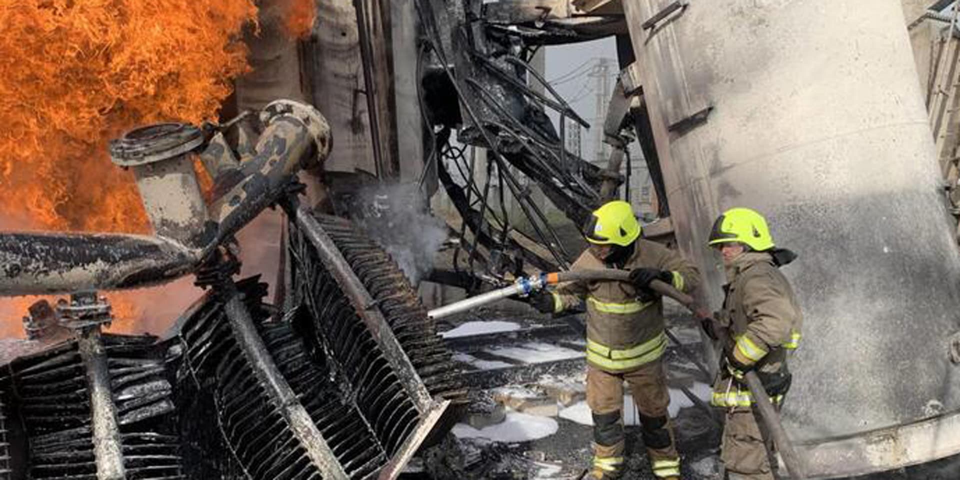 Ukrainian firefighters battle a blaze following a Russia air strike on an energy facility in Rivne