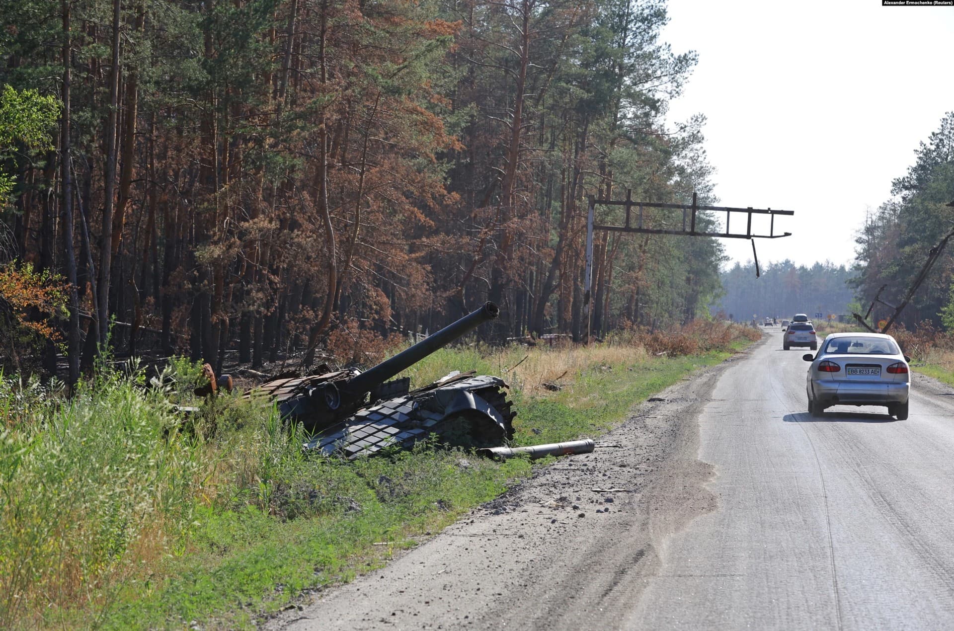 A destroyed armored vehicle alongside the road leading to the city of Syevyerodonetsk