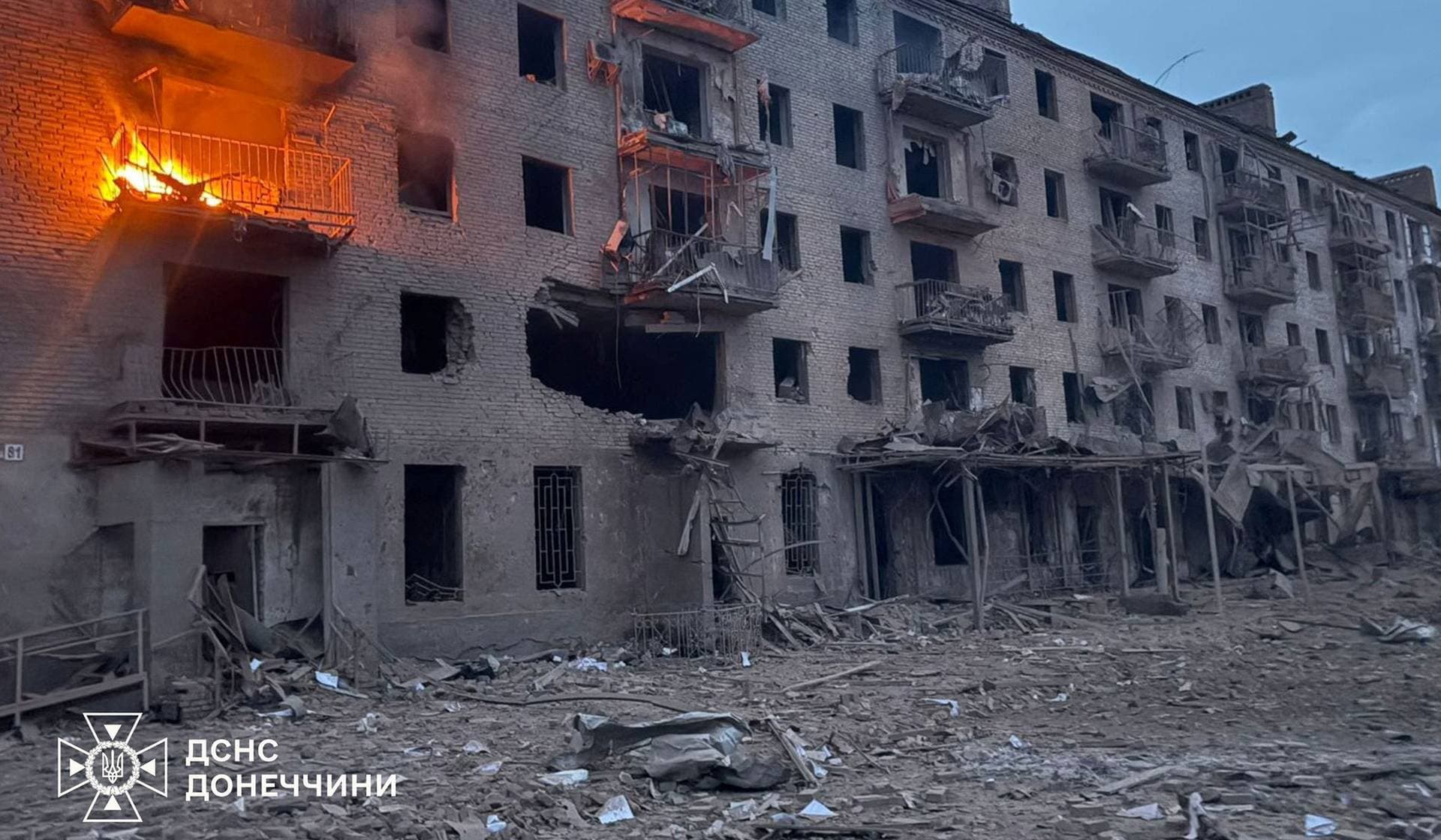 Smoke and fire rise from an apartment building, which was hit during a Russian airstrike in Sloviansk