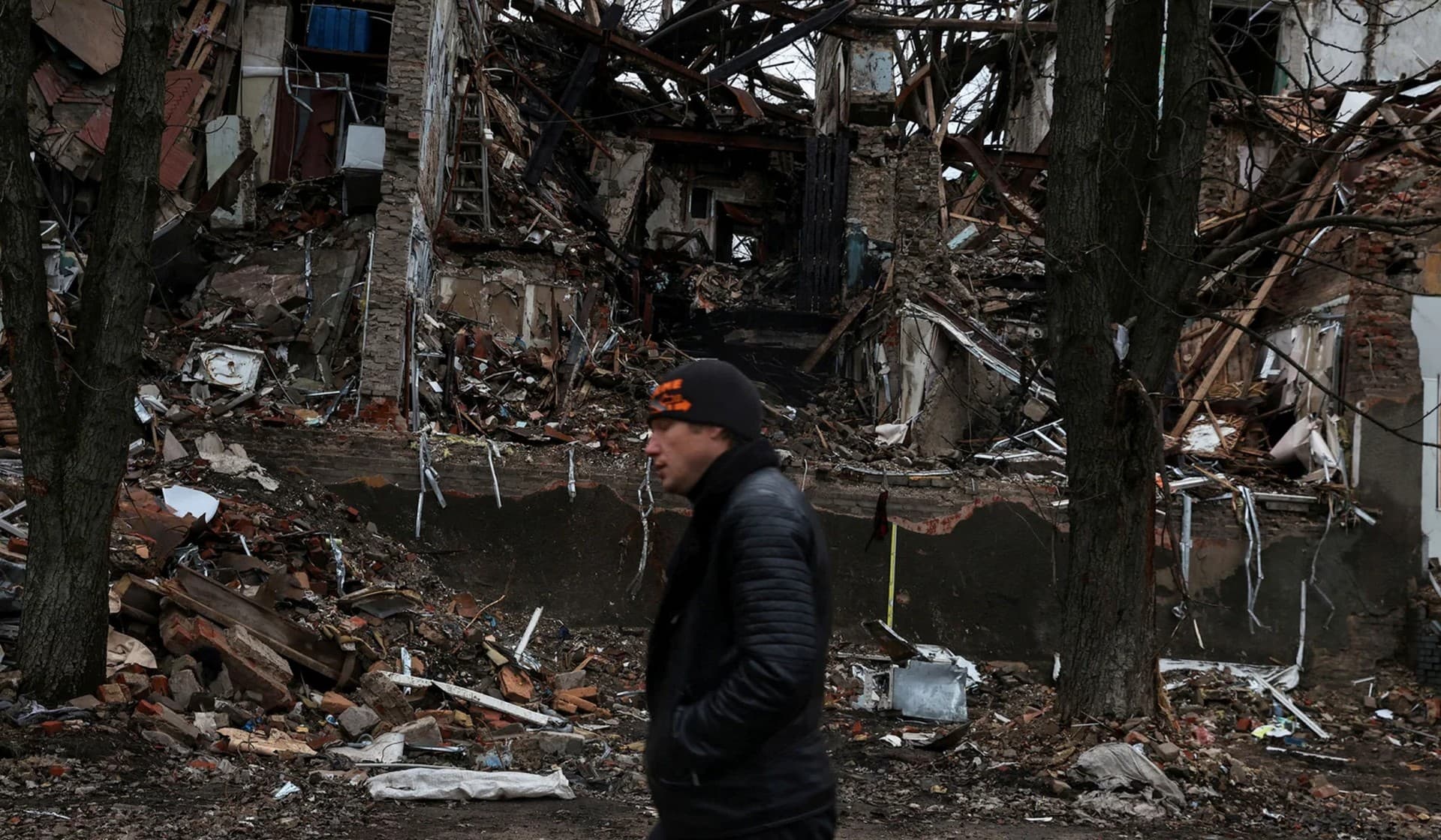 A man walks down a war-torn street in Slovyansk