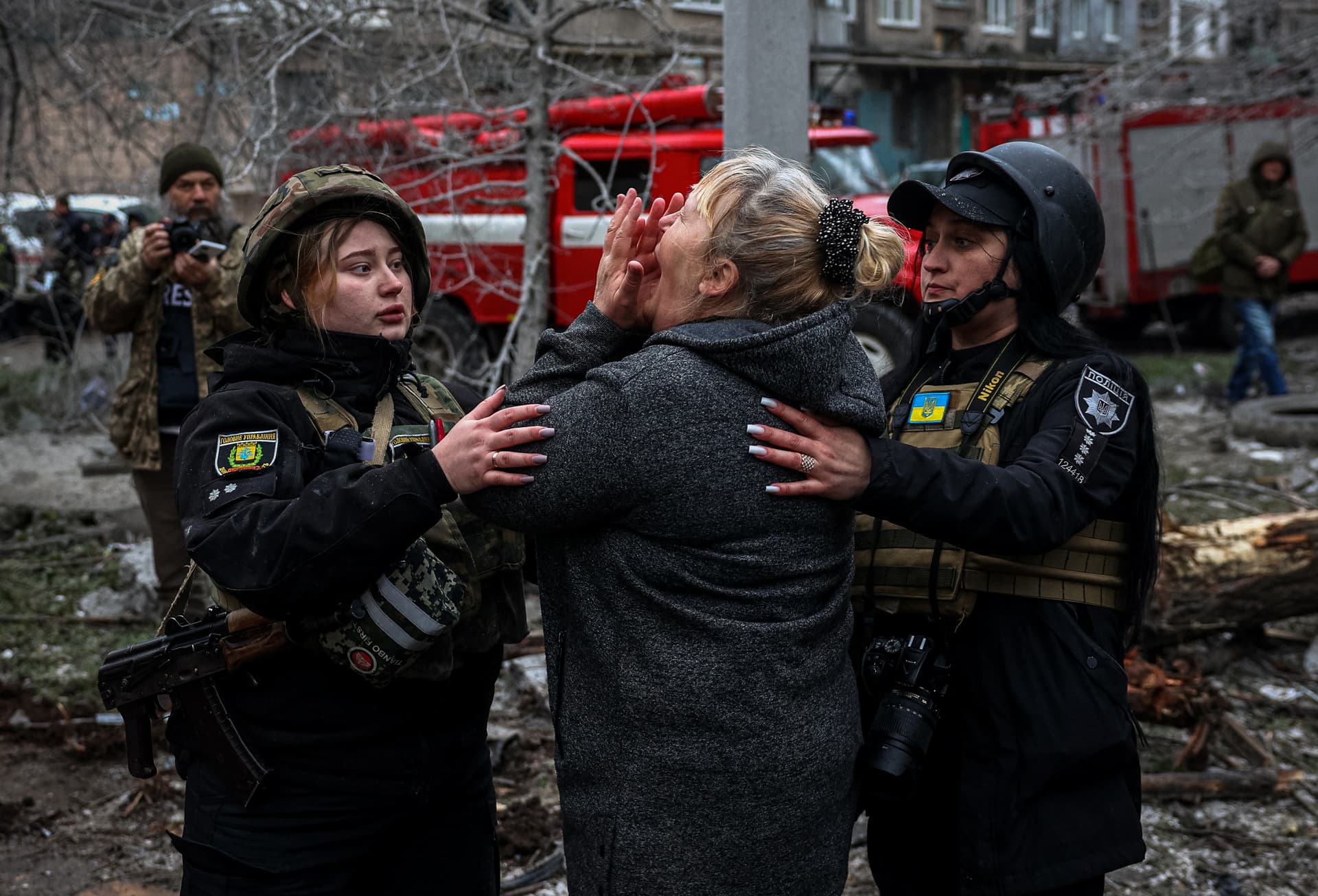 A woman reacts to an attack on a residential building in Sloviansk
