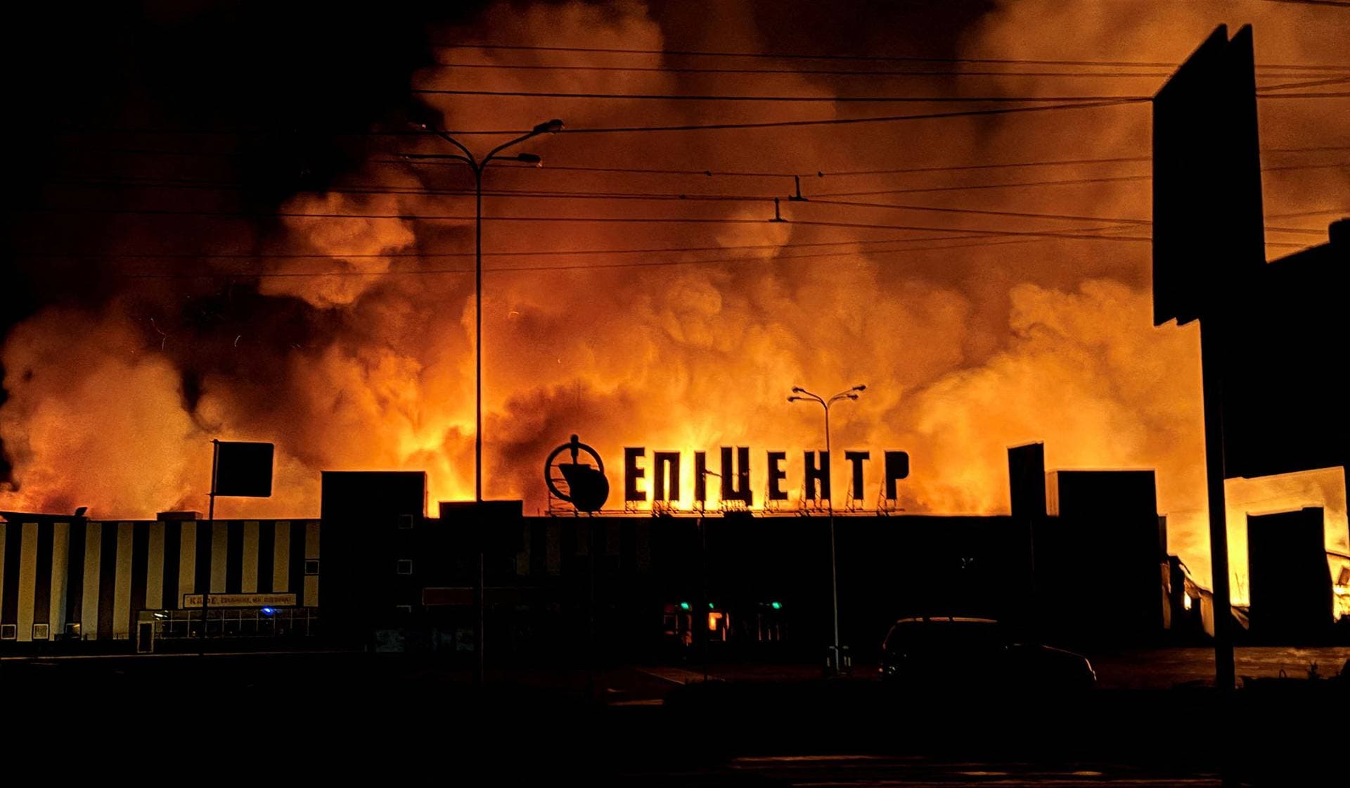 Smoke rises from a household item shopping mall which was hit by a Russian drone strike in Sumy