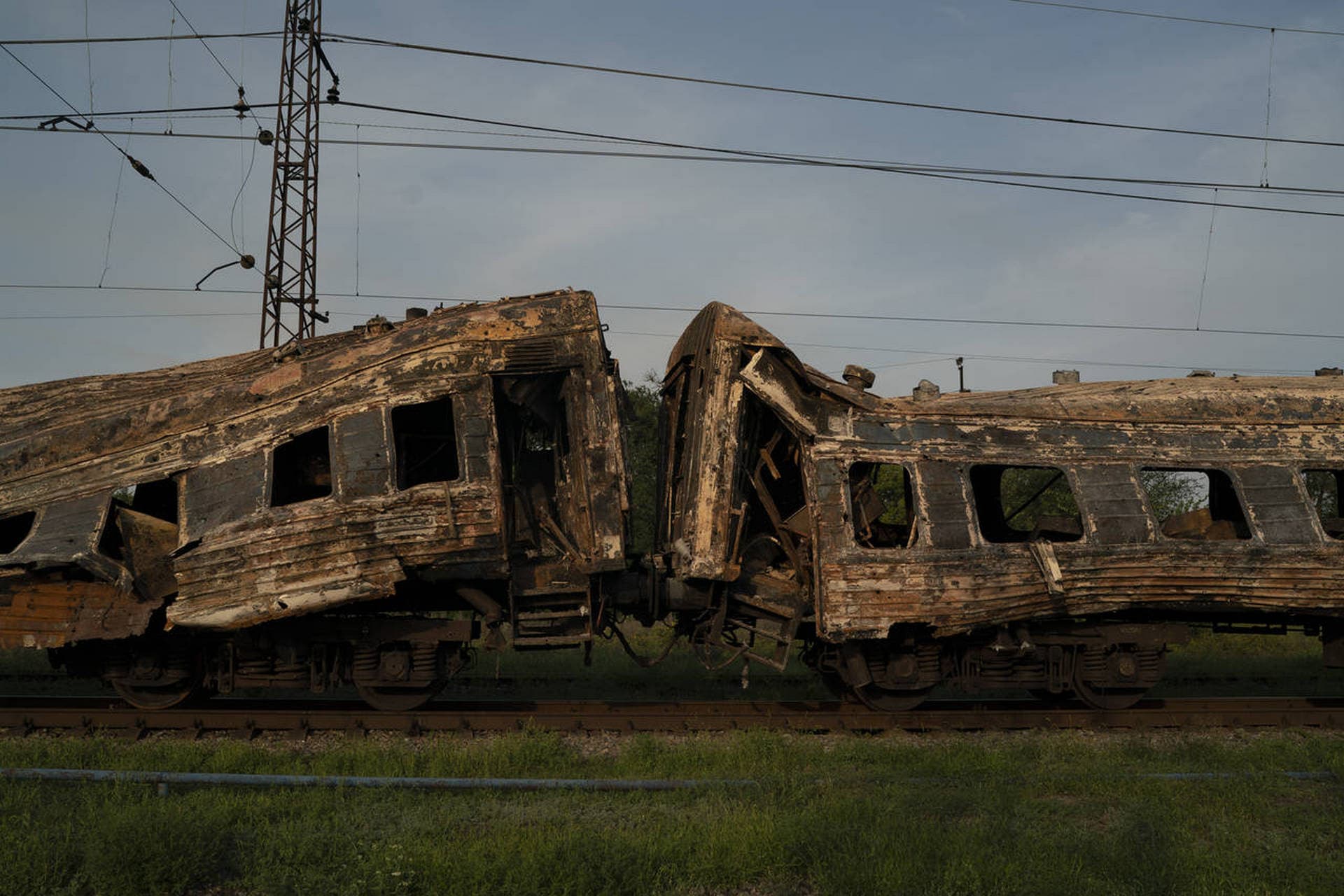A heavily damaged train is seen at a train station after a Russian attack yesterday during Ukraine's Independence Day in the village Chaplyne