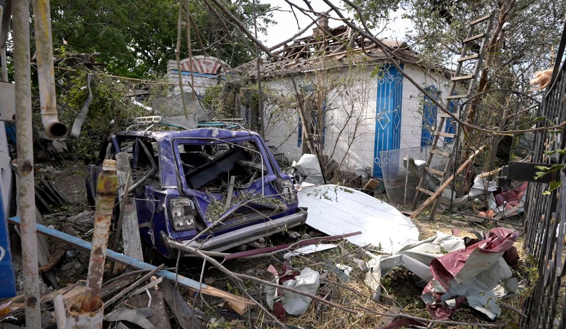 In this frame grab provided from AP TV, a site of destroyed houses seen after a Russian attack in the village Chaplyne