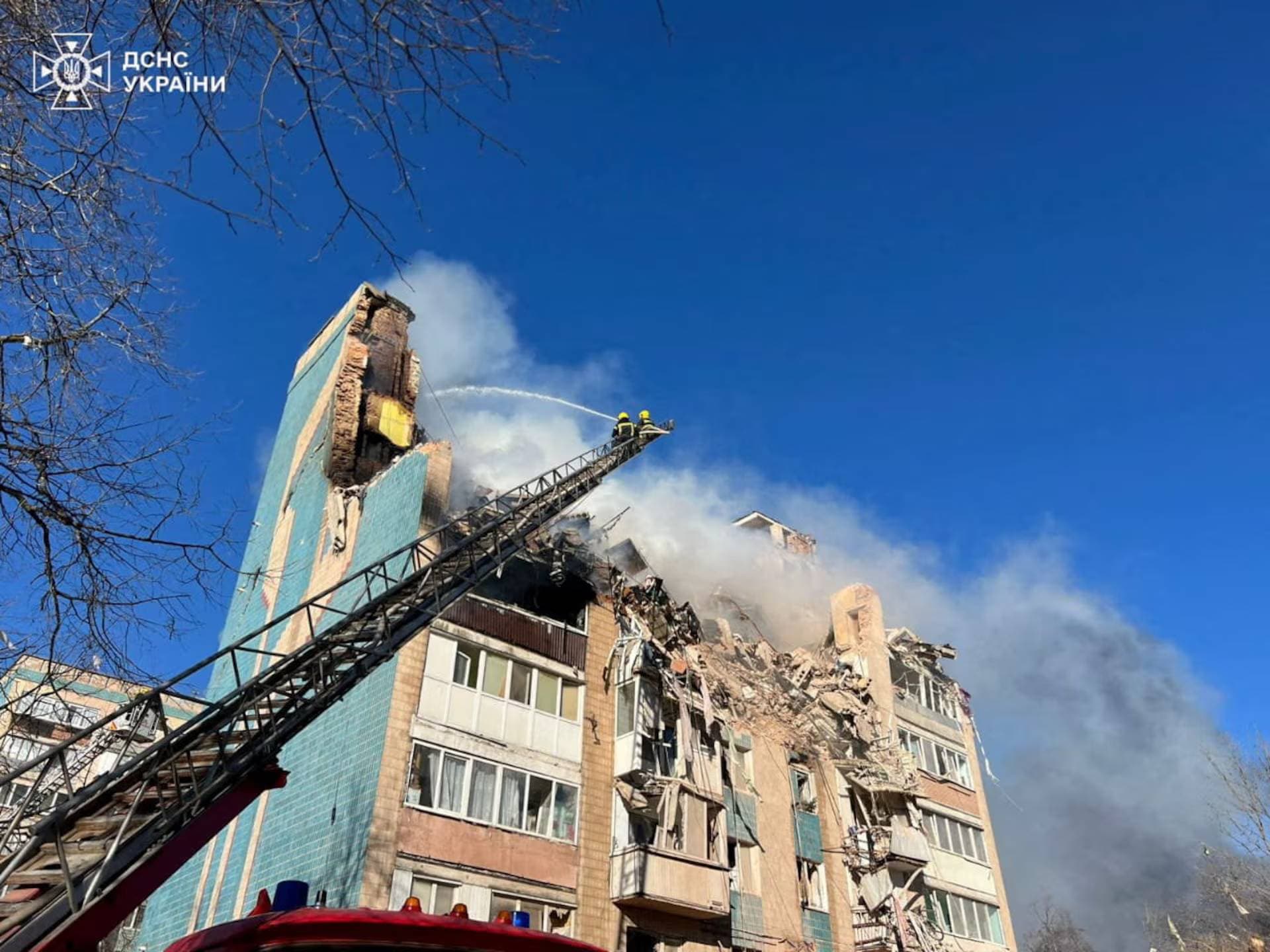 Rescuers work at the site of the apartment building hit by a morning Russian missile strike in Ternopil